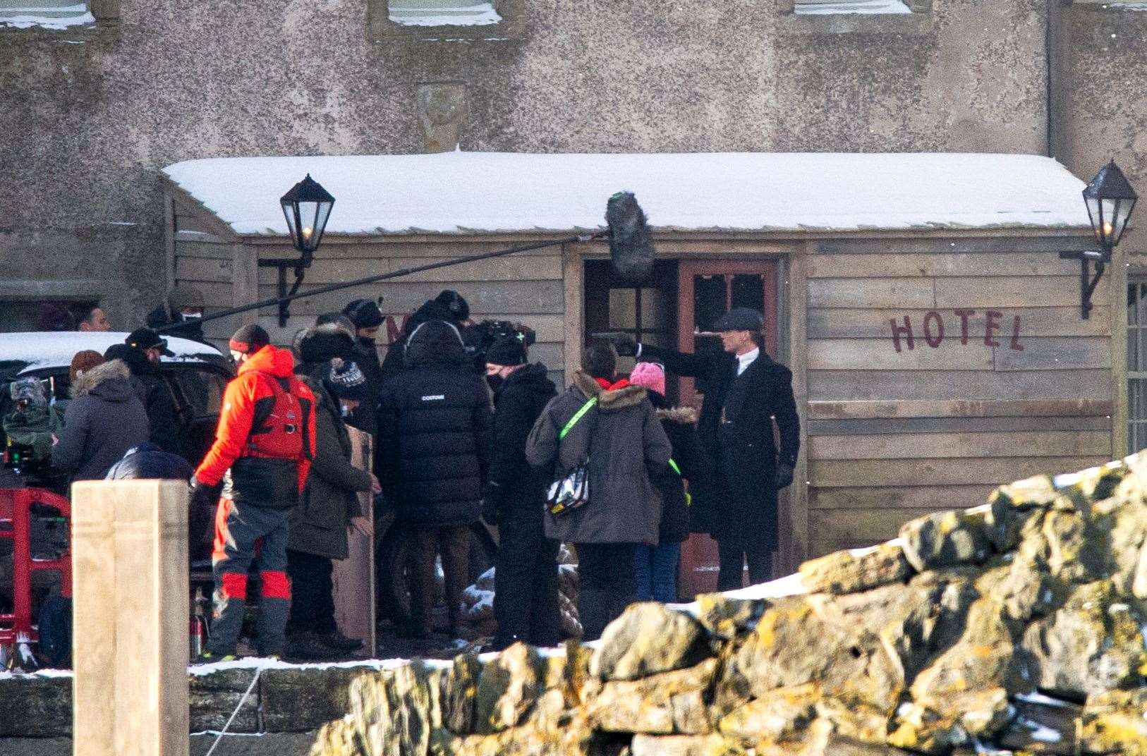 Tommy Shelby - portrayed by Cillian Murphy - aims a gun at Michael Cole during filming...Peaky Blinders filming in Portsoy 10/02/2021...Picture: Daniel Forsyth..