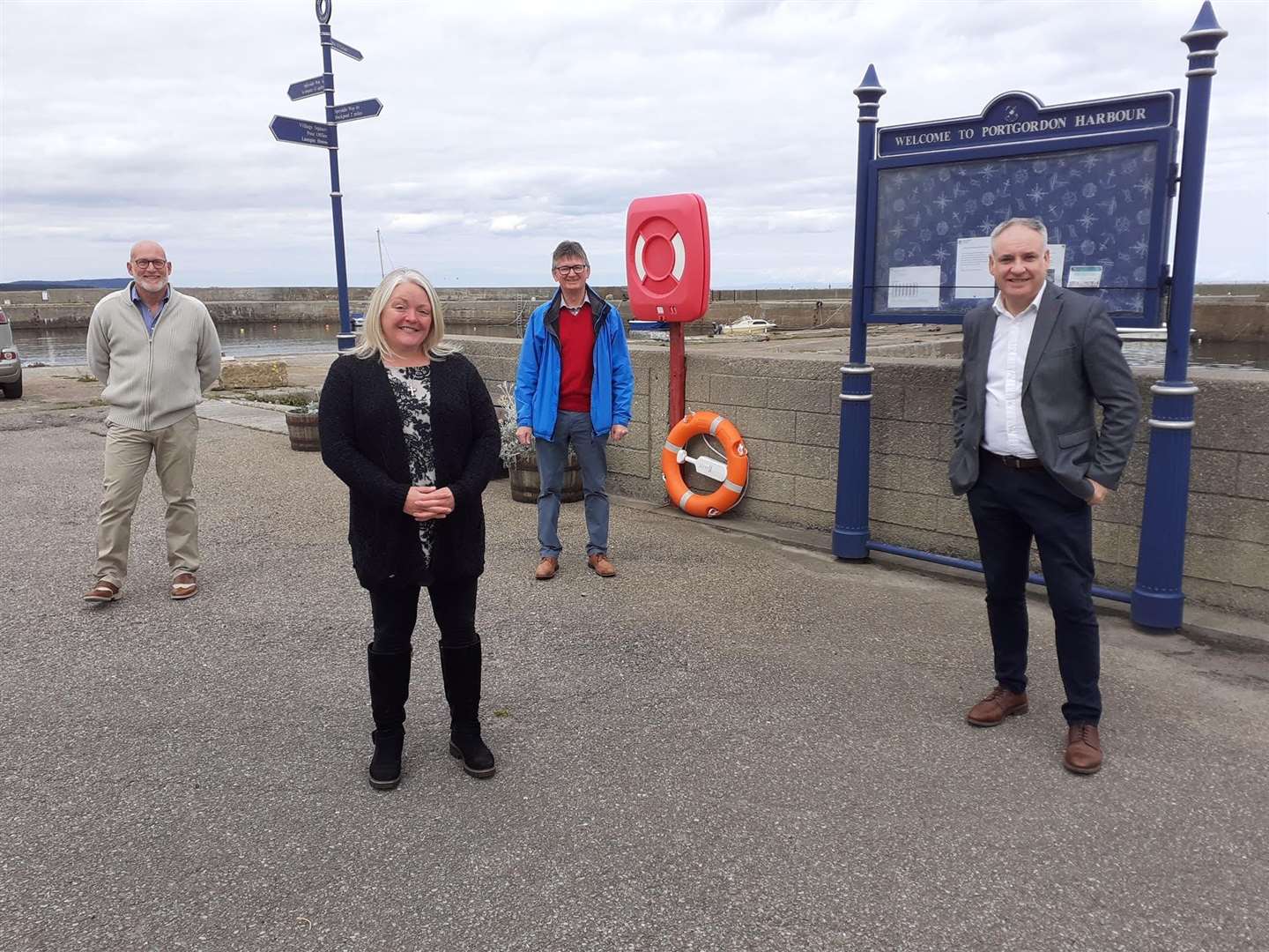 Joining Richard Lochhead MSP (right) at Portgordon Harbour are harbour group chairman Scott Sliter (left), vice-chairman Colin Hanover and tsiMoray community development officer Michelle Good. Picture: Moray SNP