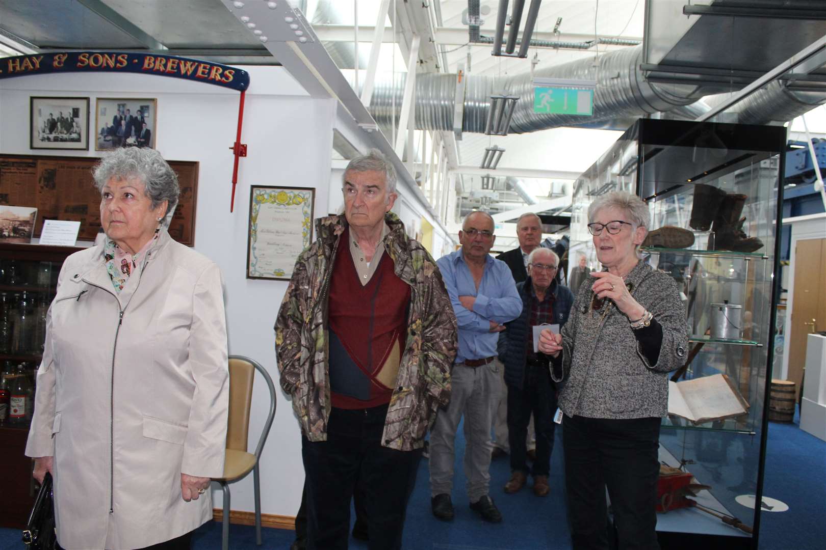 Joan Bruce lead members on a tour of the new exhibition.