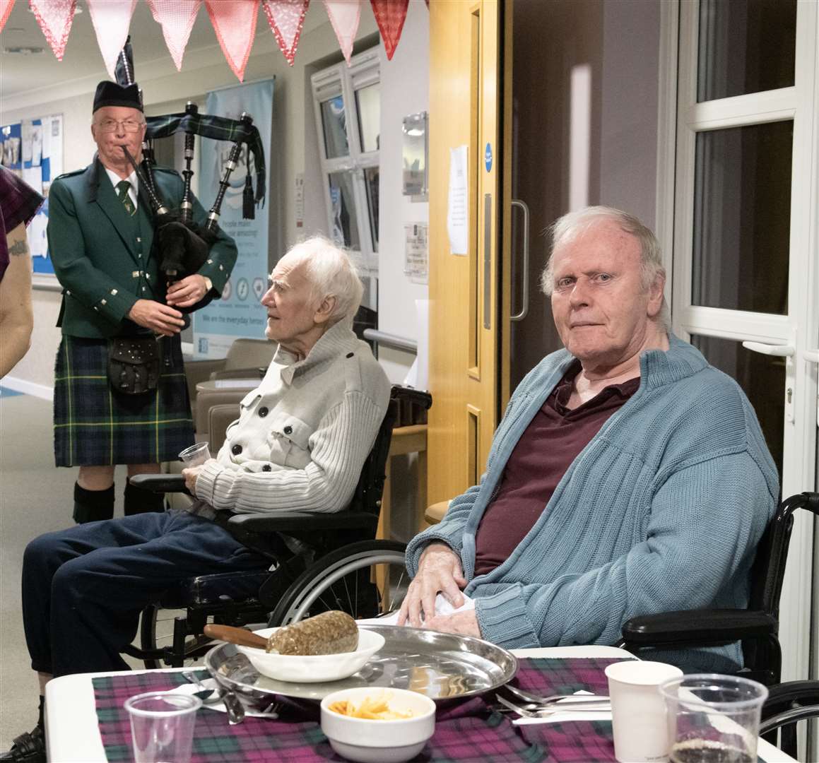 Hamish Dean (left) piping the Haggis in while Bill Duff (right) waits to address the Haggis...Balhousie Care Home Burns Supper in Huntly...Picture: Beth Taylor.