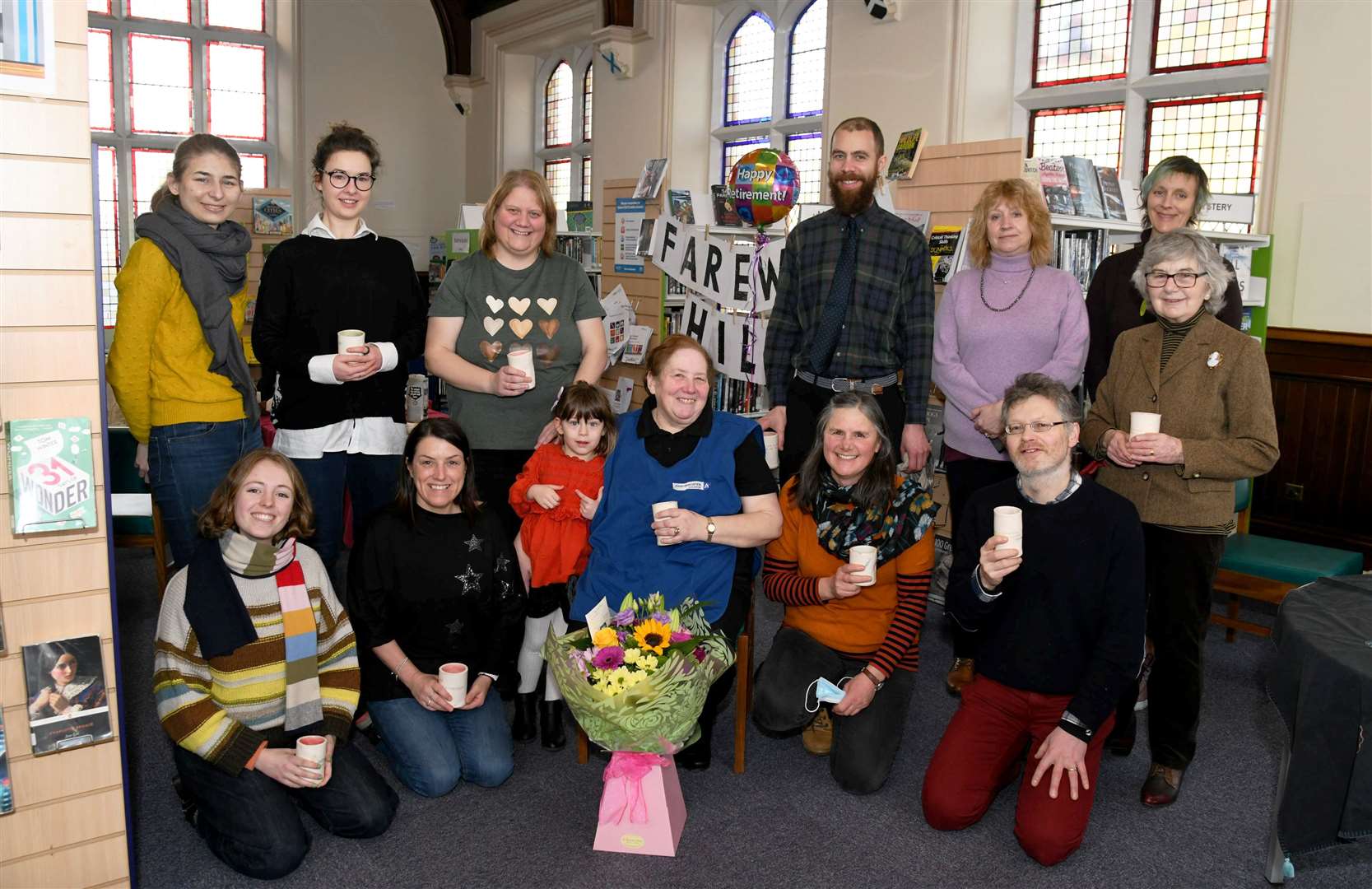 Hilda Fowler surrounded with some of the library users and staff team who sent her warmly off into retirement at a gathering last week. Picture: Becky Saunderson.