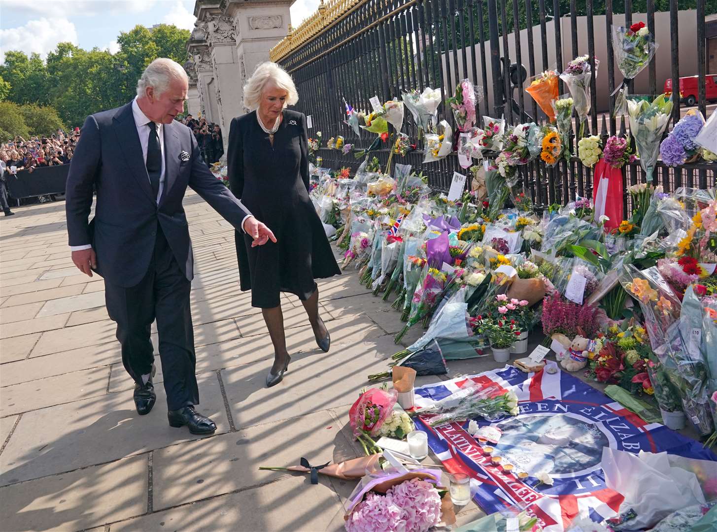 King Charles III and the Queen view tributes left outside Buckingham Palace (Yui Mok/PA)