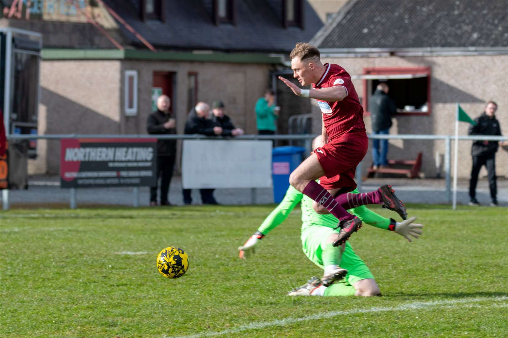 Keith's Gavin Elphinstone leaps over Huntly's Fraser Hobday for an open goal.Keith F.C (1) v Huntly F.C (0) at Kynoch Park, Keith. Highland Football League.Picture: Beth Taylor