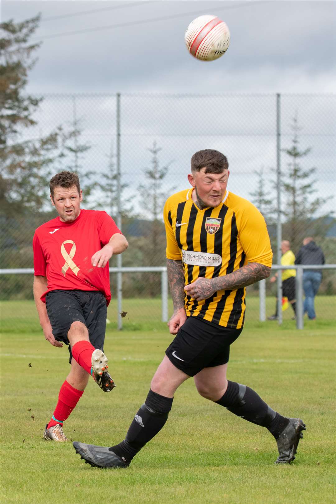 Vale legend Kyle Mackay clears the ball away from Islavale's Owen Christie. ..Picture: Daniel Forsyth..