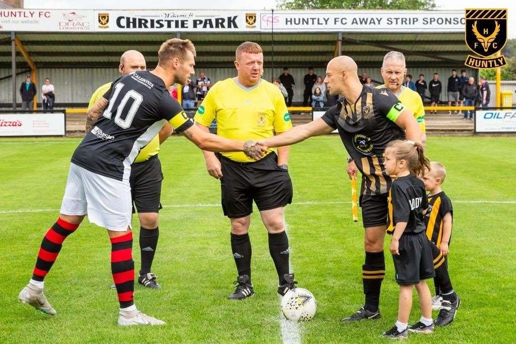 Thoirs shakes hands with Elgin captain Brian Cameron at kick-off time. Photo: George Mackie