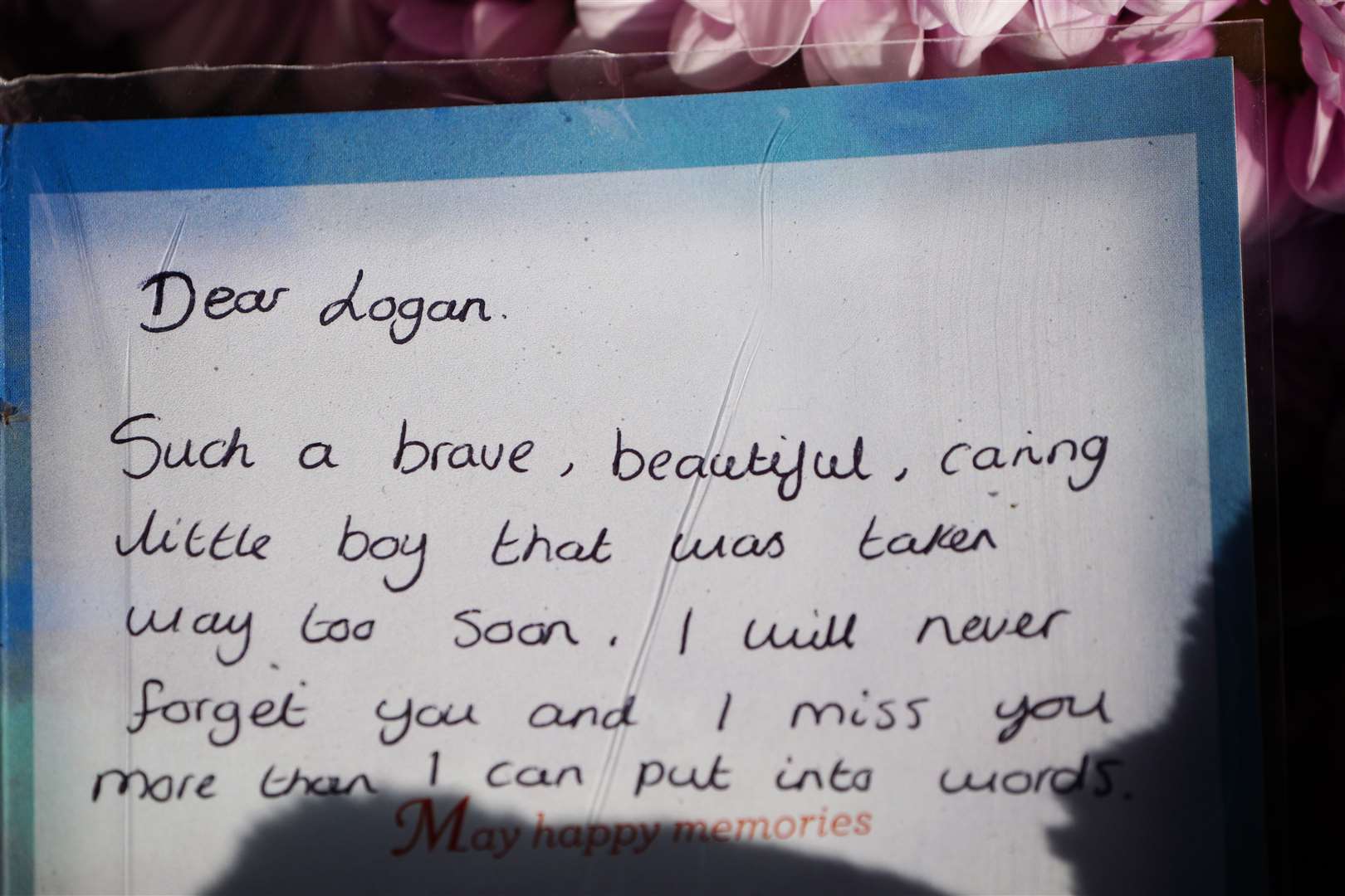 Tributes left at the scene where five-year-old Logan was found dead (Ben Birchall/PA)