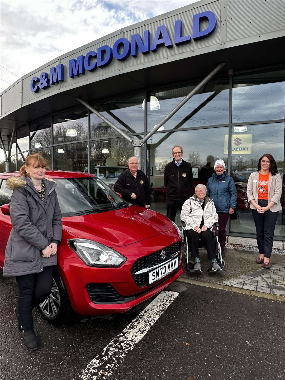 The winner Lorraine Eldridge from Marykirk collected her new car at C&M McDonald.