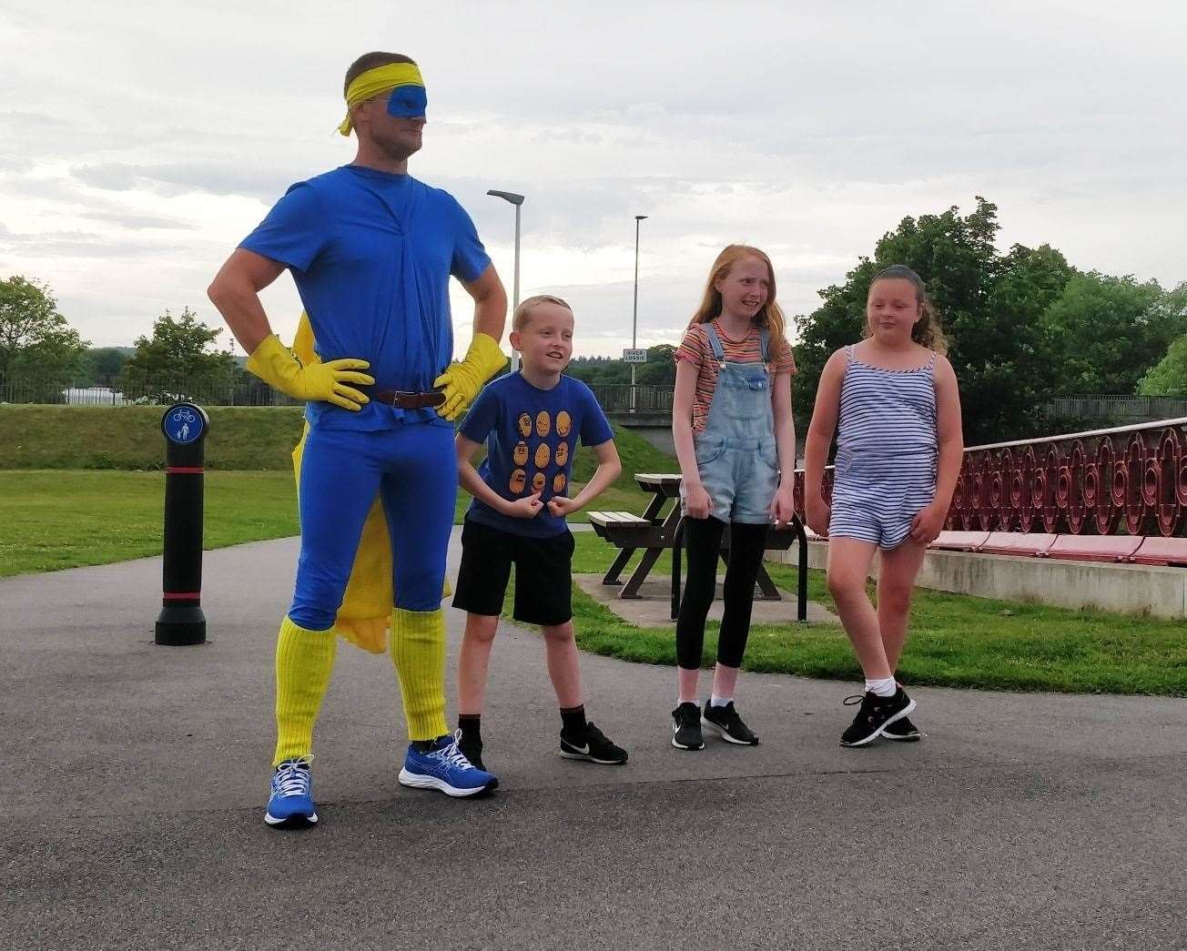 Outfit Moray outdoor instructor Andy Woolnough dressed as Bananaman at Elgin's Cooper Park as he completed the charity's Summer Challenge.