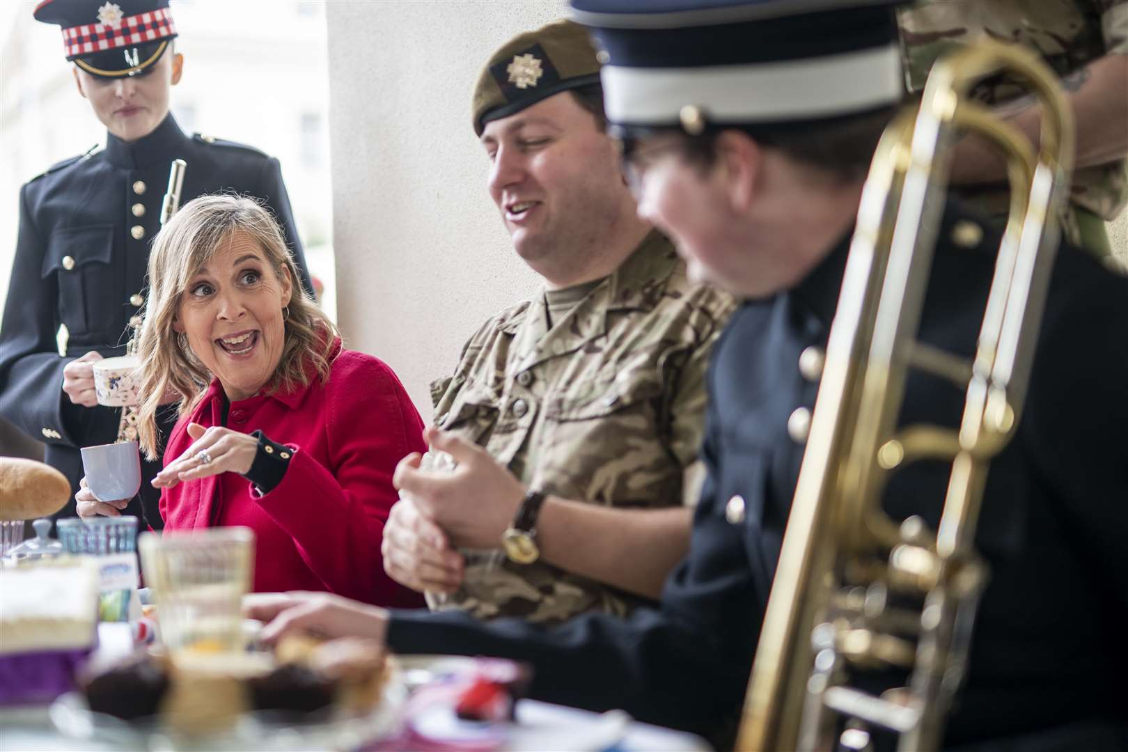 Presenter Mel Giedroyc with members of the Scots Guards and Coldstream Guards (Aaron Chown/PA)