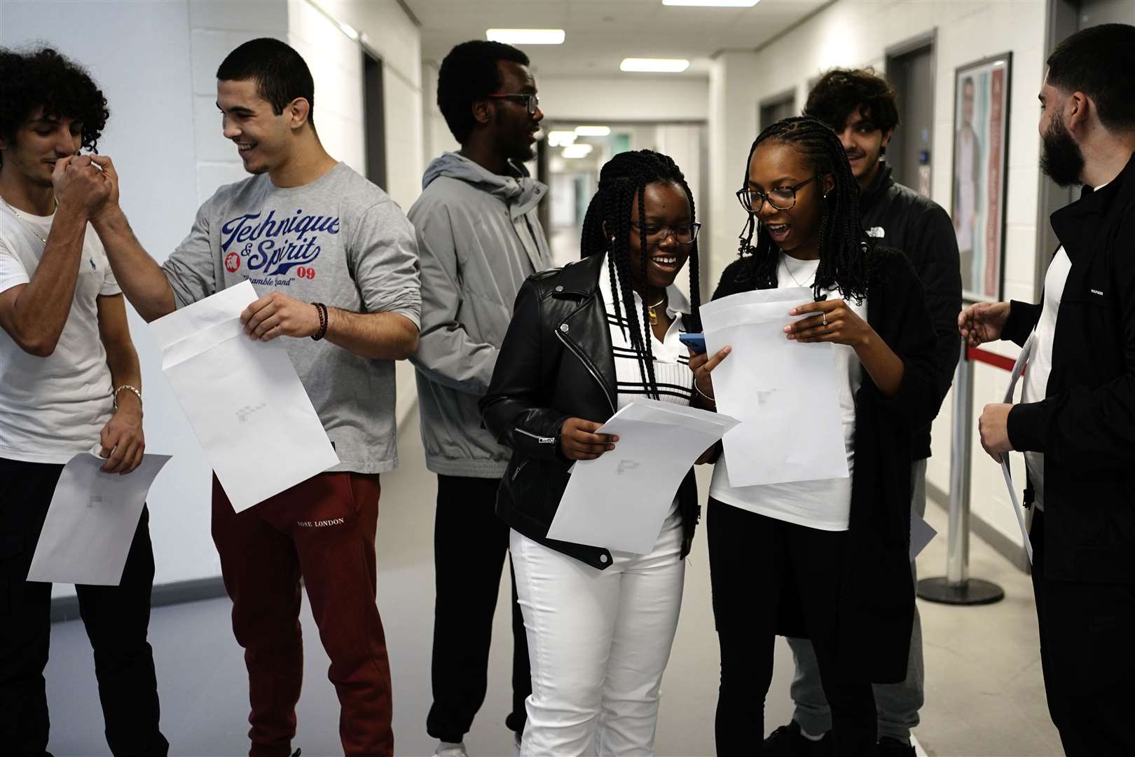 Students at Ark Acton Academy in Acton, west London, got together to compare results (Aaron Chown/PA)