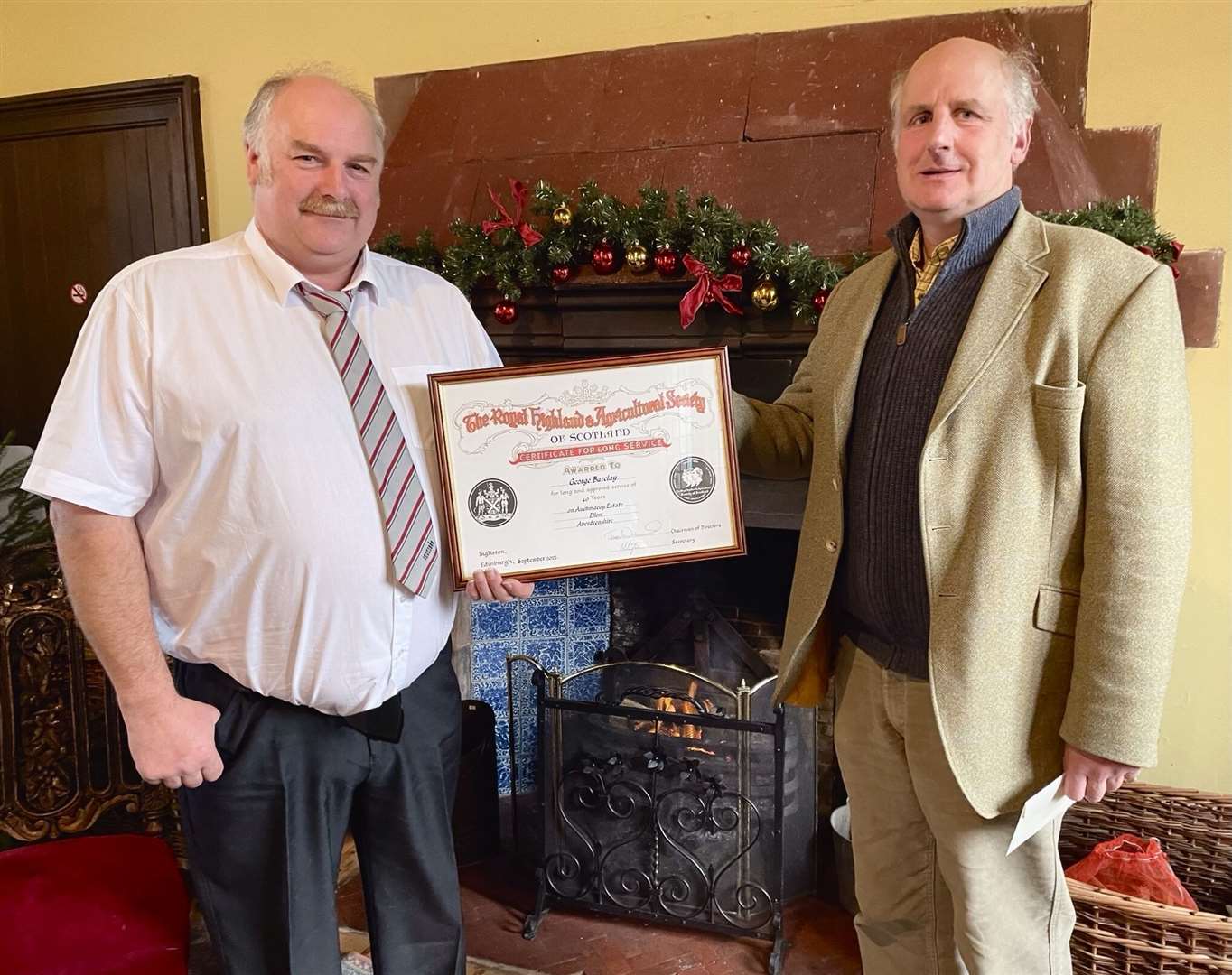George Barclay (left) received his 40 years service certificate from Charles Buchan. Picture: Phil Harman