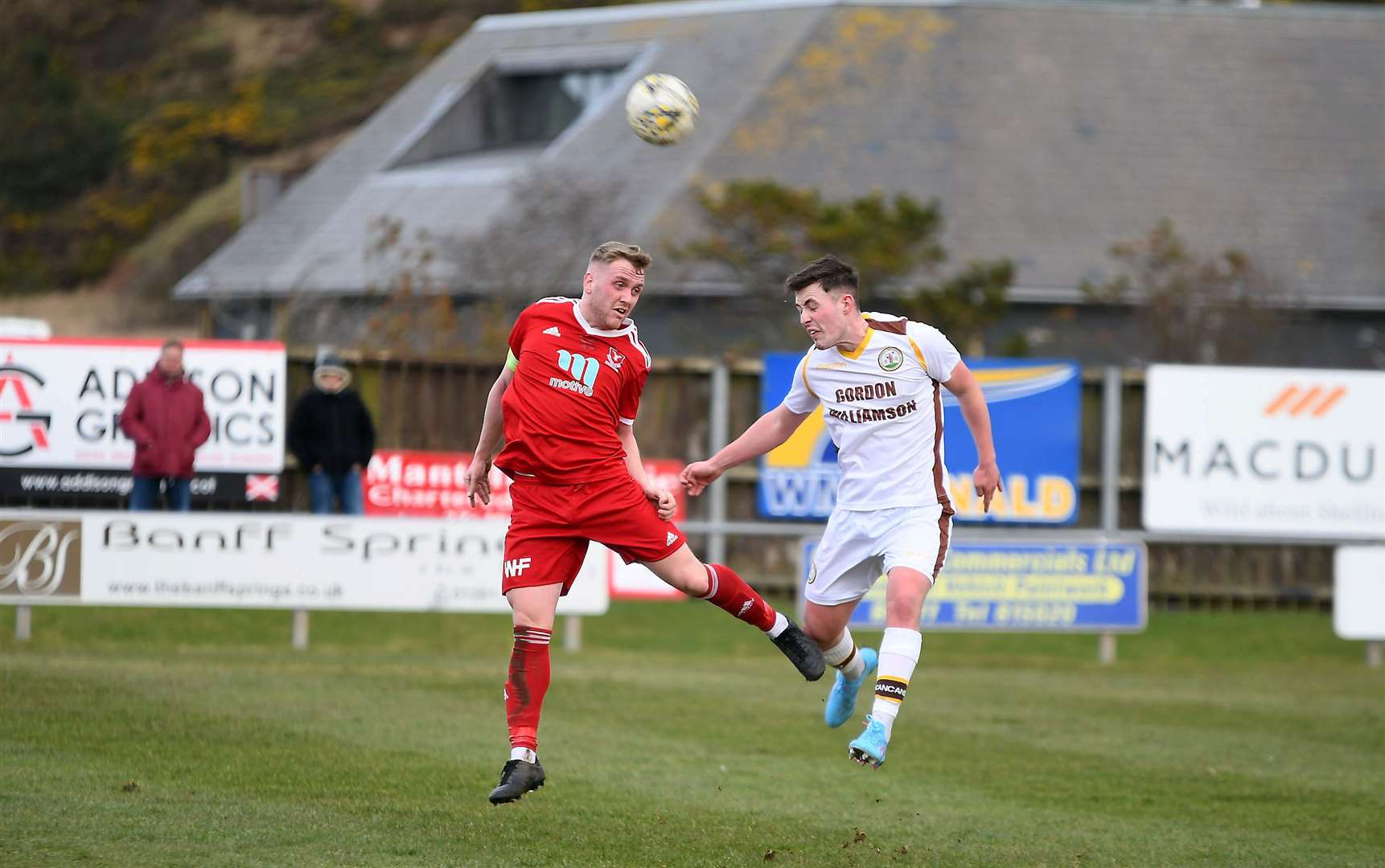 Vale skipper for the day Rory Davidson wins a headed duel with Forres' Kane Davies. Picture: Becky Saunderson..