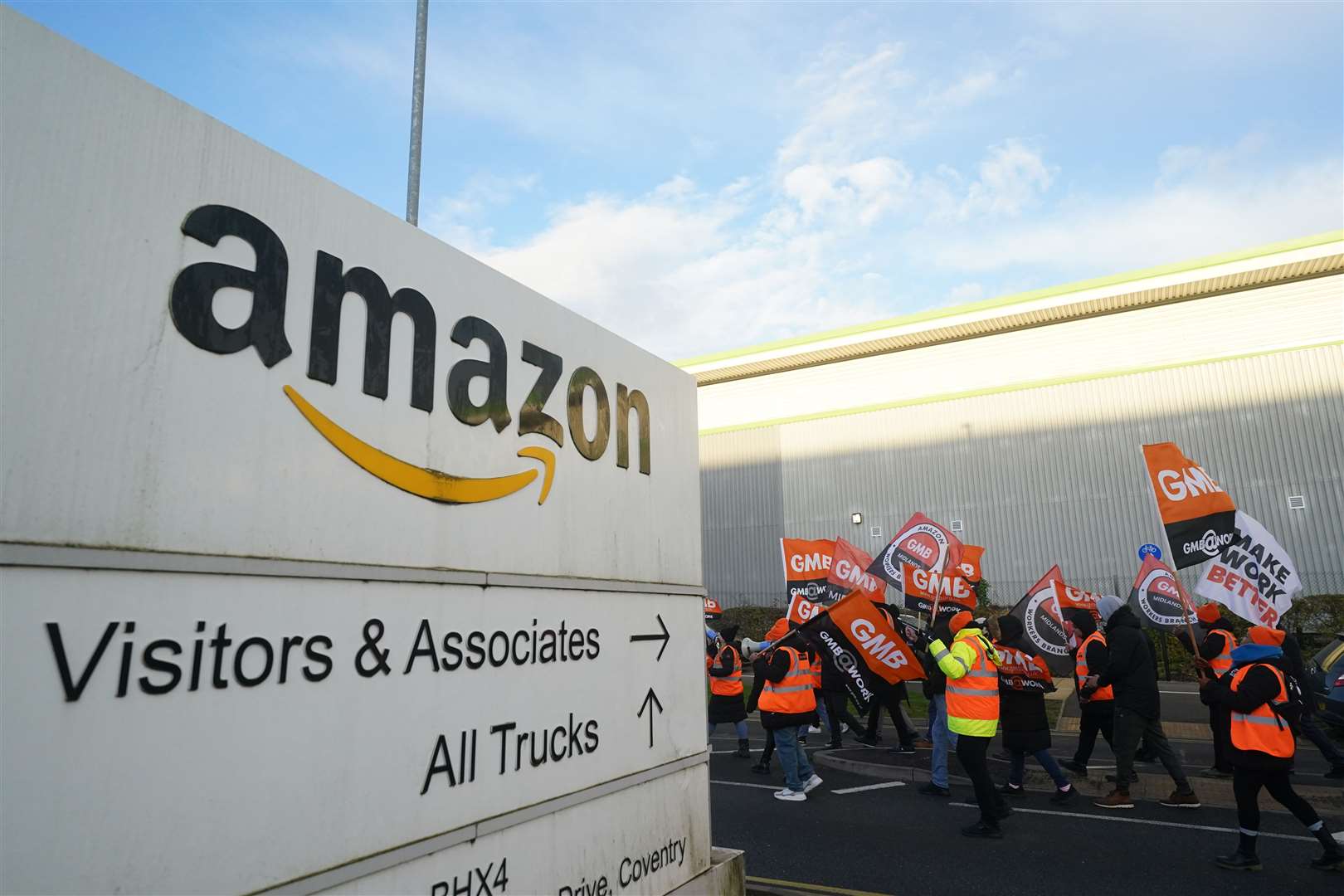 Striking Amazon workers are engaged in a long-running dispute over pay (Jacob King/PA)