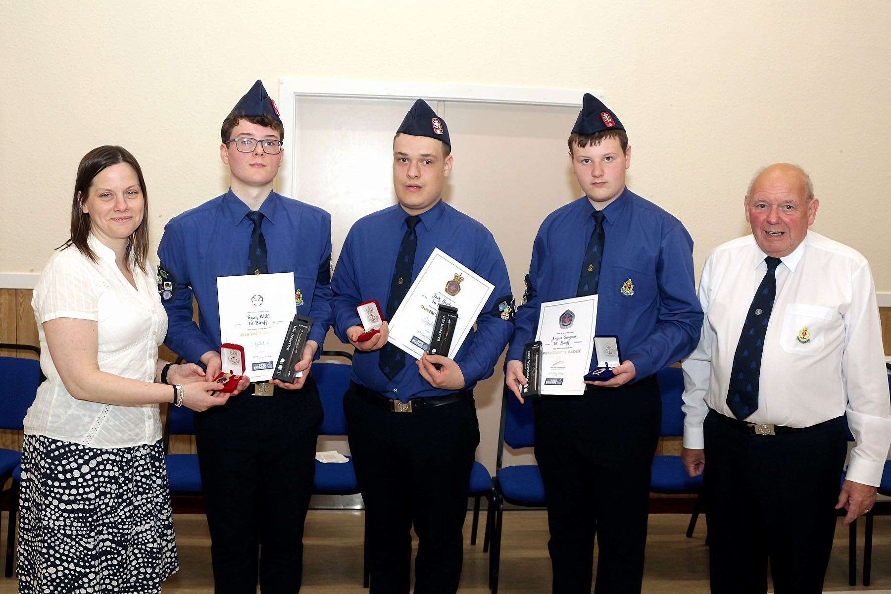 Inspecting officer Banff Primary School head teacher Laura Mackay and Captain Ian Cameron present Queen's Badges and certificates to Ryan Watt and Jack Graham and The President's Badge to Angus Simpson. Picture: Andrew Taylor