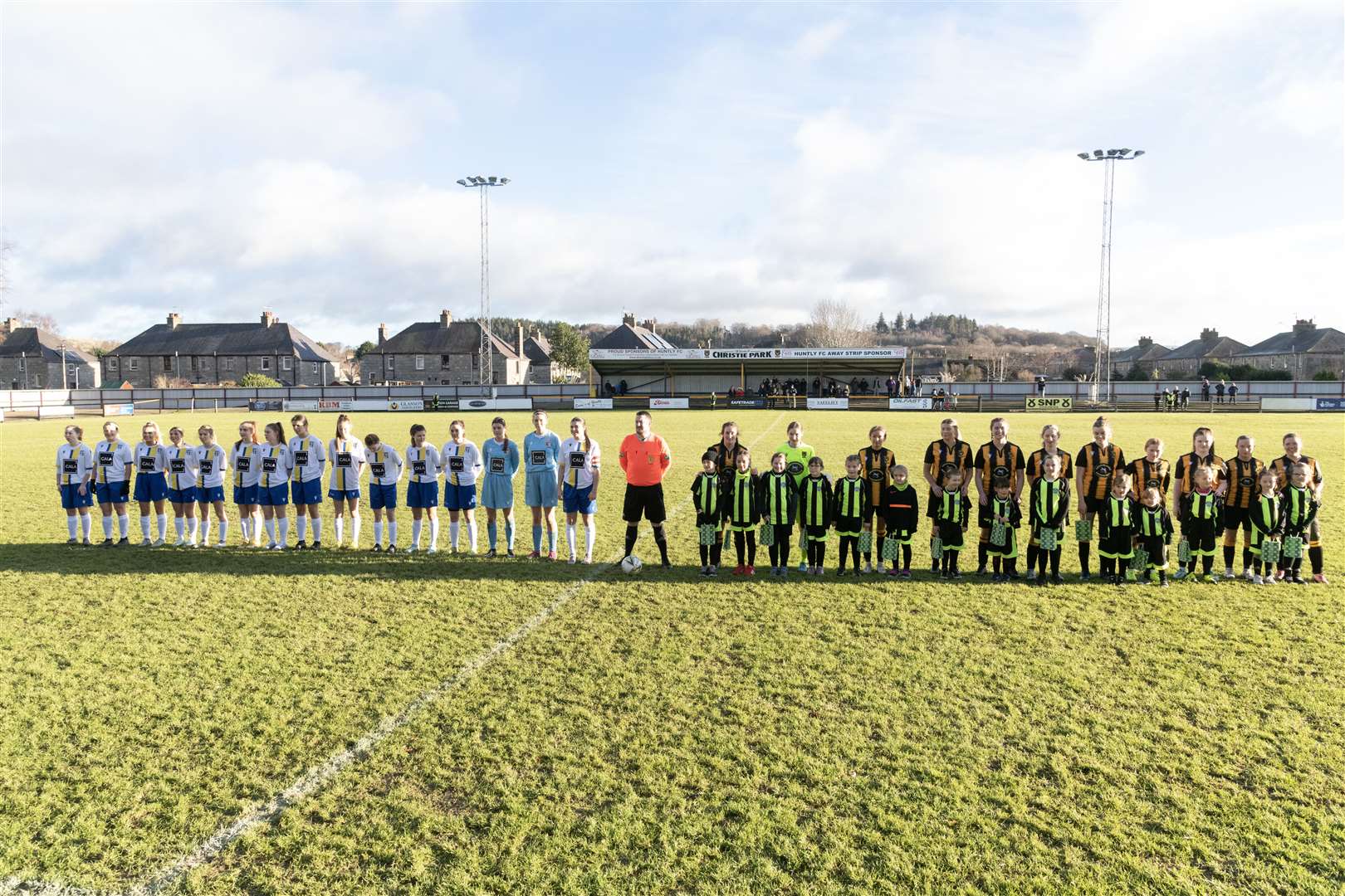Huntly Women's team lined up with their mascots ahead of their first match. ..Huntly Women's F.C. v Inverurie Locos Works F.C Ladies at Christie Park...Picture: Beth Taylor.