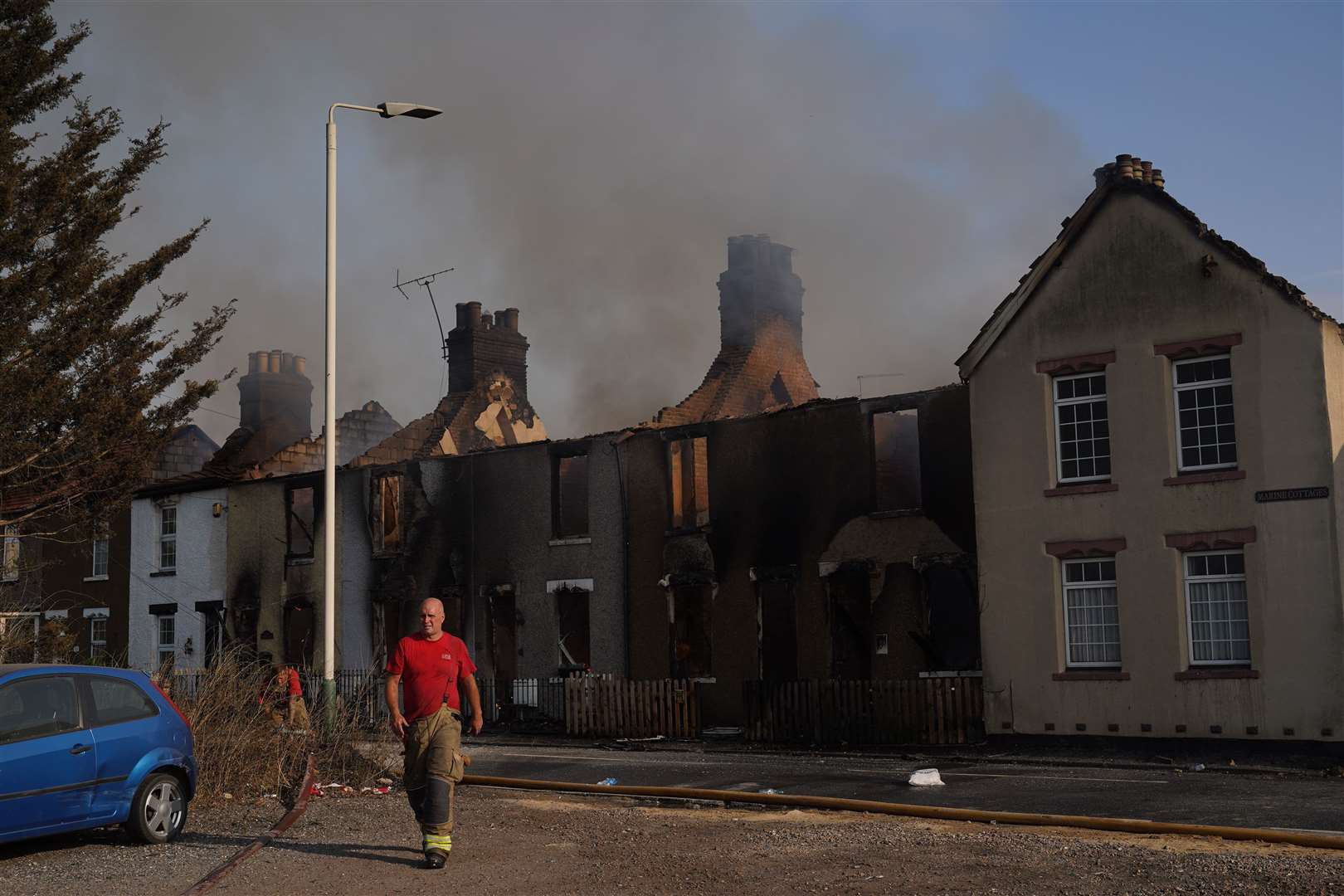 Firefighters at the scene in Wennington (Yui Mok/PA)