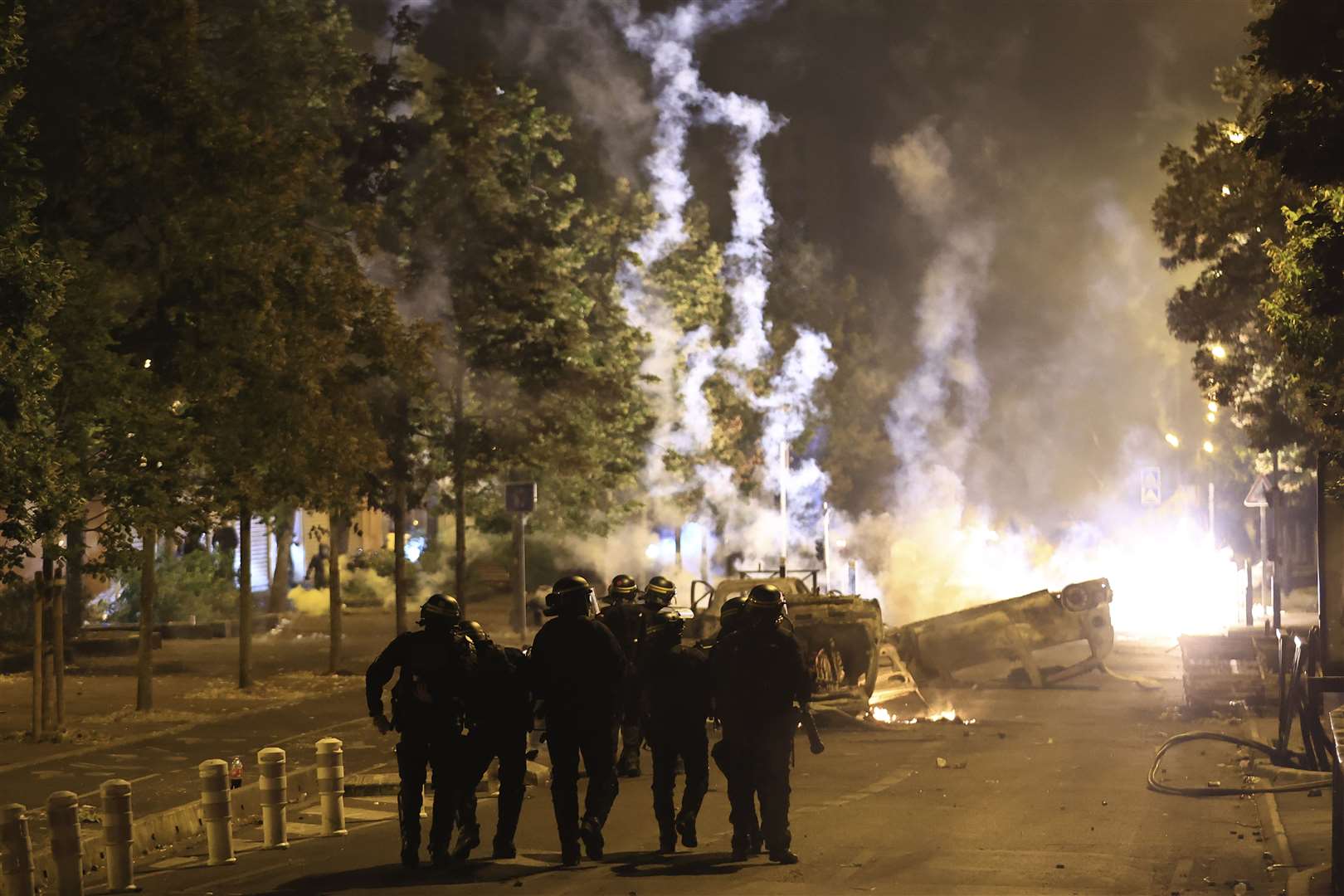 Riot police officers on patrol (Aurelien Morissard/AP)