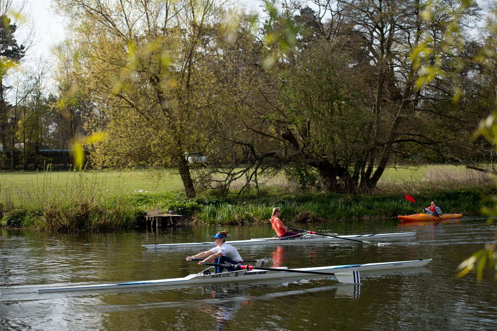 Rowers on the River Avon pass St Nicholas’ Park, in Warwick (Jacob King/PA)