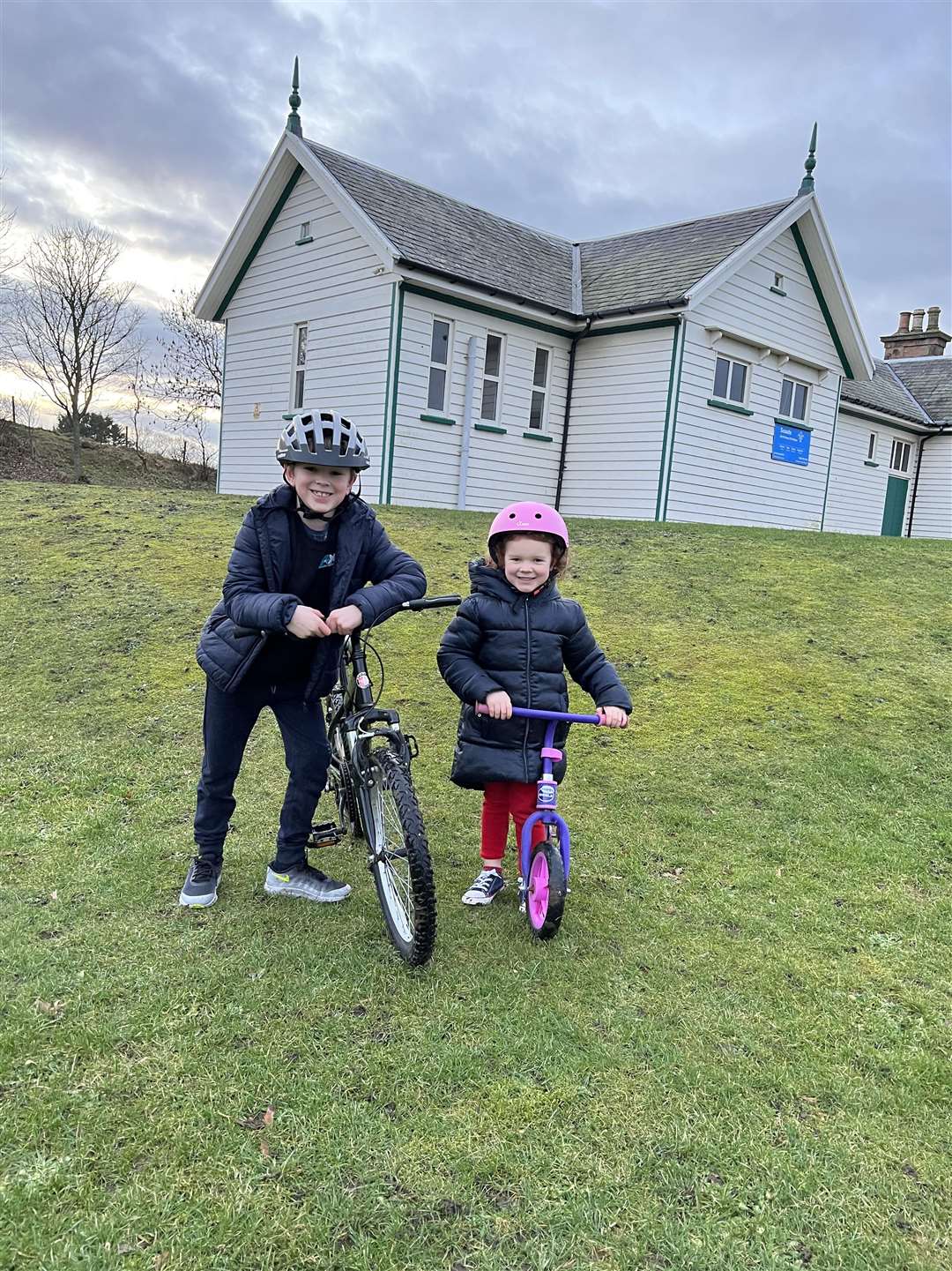 Cammy with his sister Macey on their bikes.