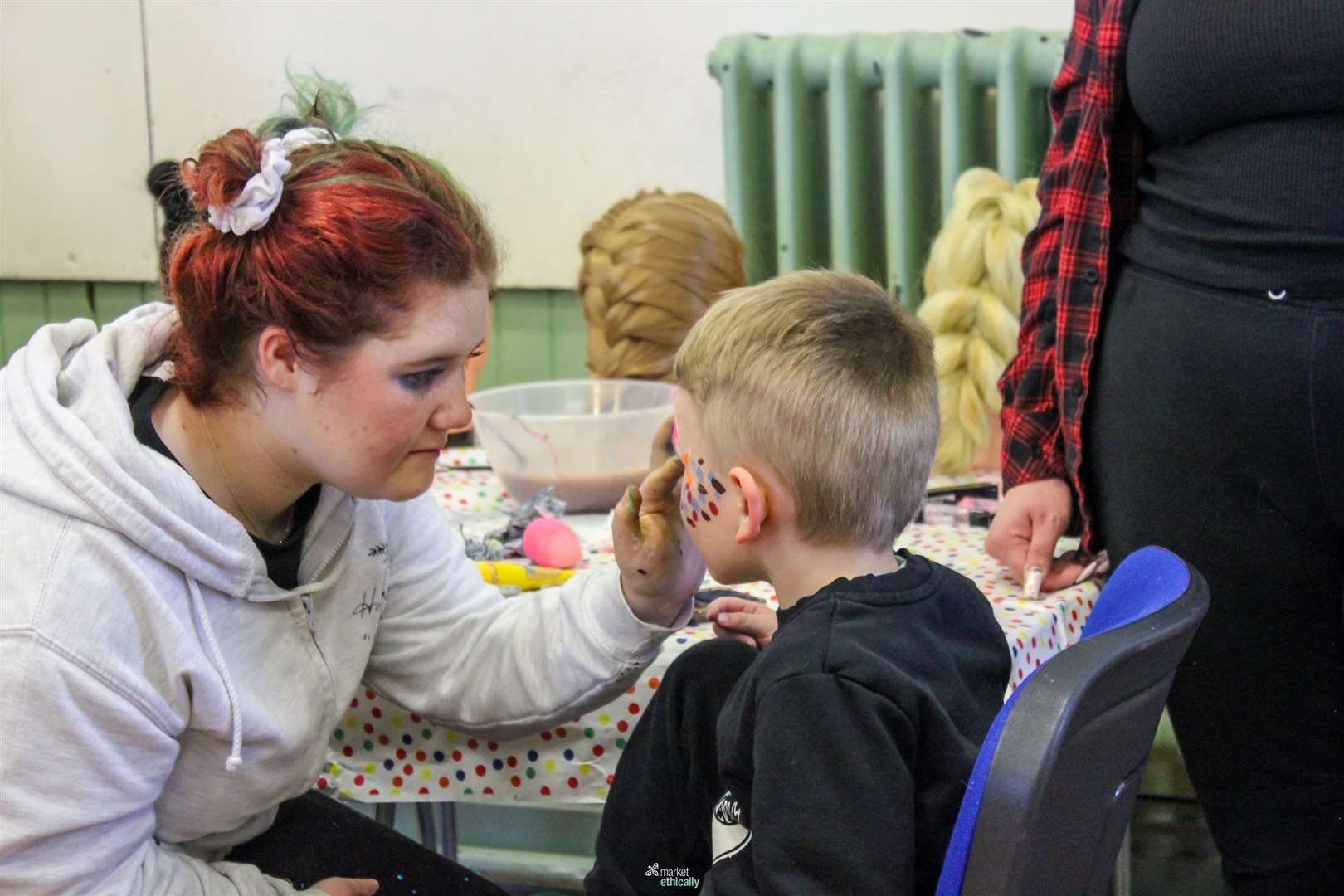 Face painting fun at the fundraiser. Image courtesy of Market Ethically