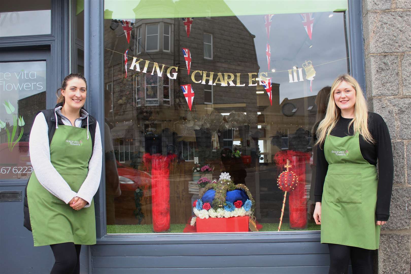 Dolce Vita florists Kristen Knight (right) and Linsey Kingdom beside their Coronation tribute in the shop window in West High Street, Inverurie. Picture: Griselda McGregor
