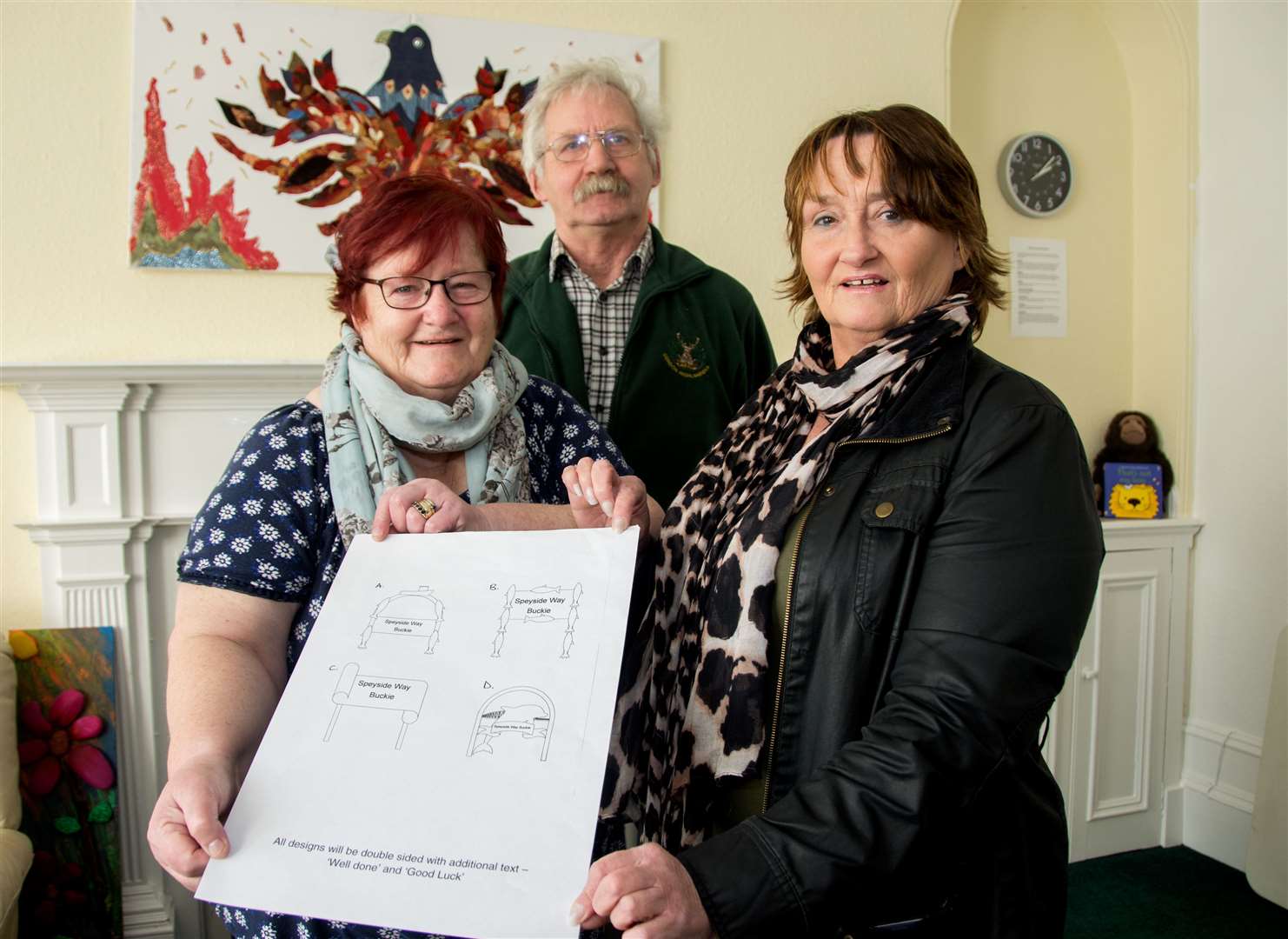 Buckie's Roots chairwoman Meg Jamieson (front left) is joined by committee members Morag Stewart and Archie Jamieson in admiring the final four designs. Picture: Becky Saunderson