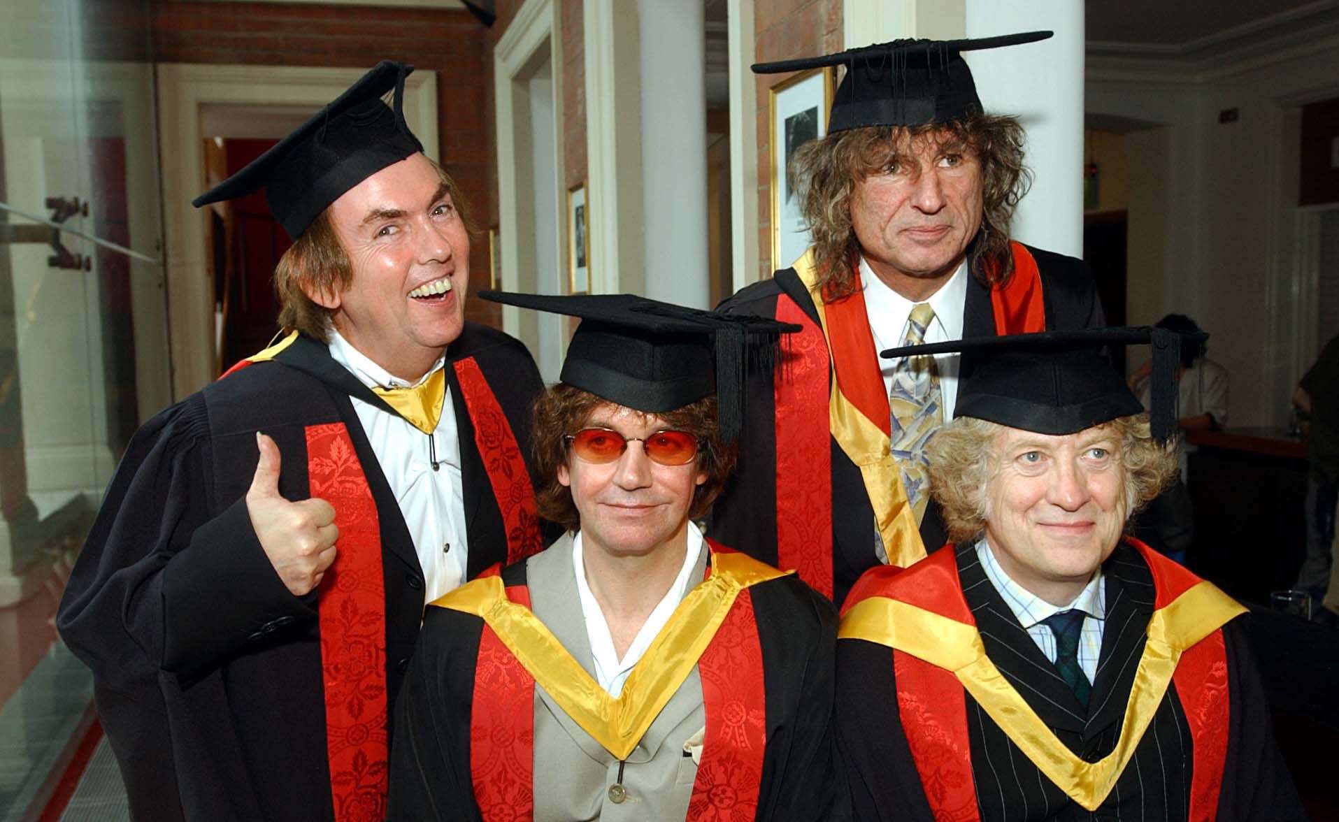 Former members of ‘Slade, from left, Noddy Holder, Dave Hill, Jim Lea and Don Powell, collect honorary followships from the University of Wolverhampton in 2002 (PA)