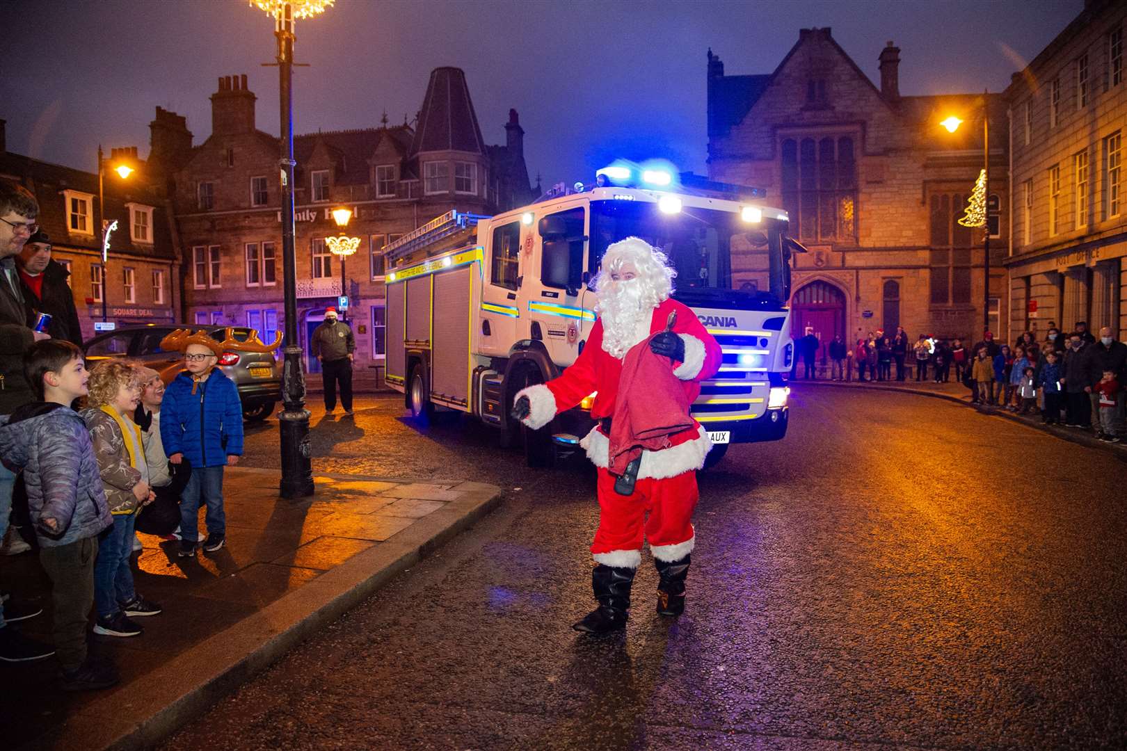 Santa arrives in Huntly Square thanks to the local fire team. Picture: Daniel Forsyth.