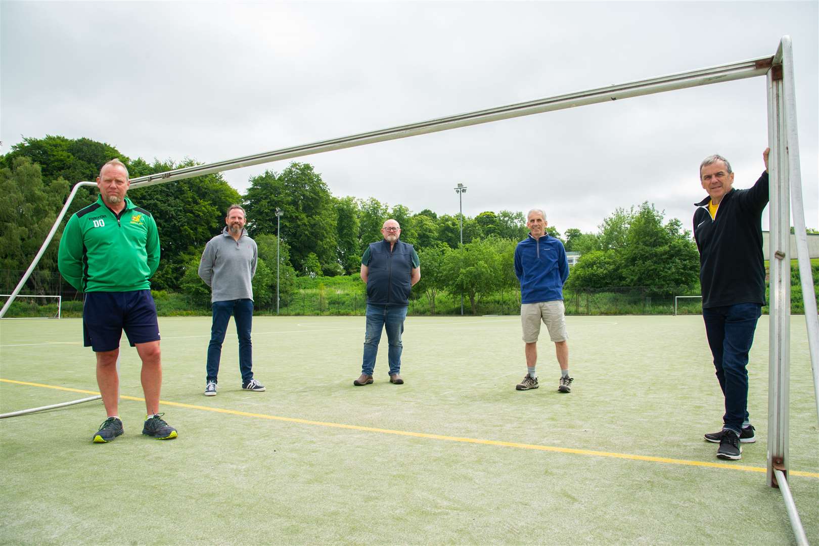 Members of the Huntly Sports Trust, from the left, Chris Lee, Dave Liston, Bruce Murray, Ian Little and Allan Mitchell at the all-weather pitch which is to be overhauled. Picture: Daniel Forsyth.