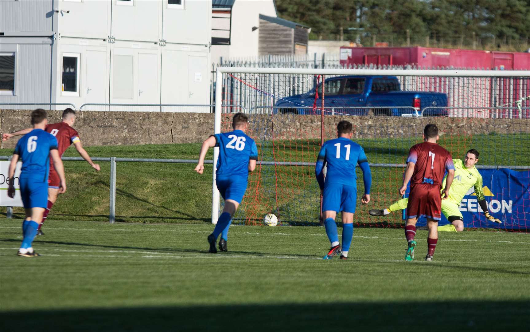 Cammy Keith scores one of his four goals in the 7-1 win against Strathspey Thistle. Picture: Becky Saunderson..