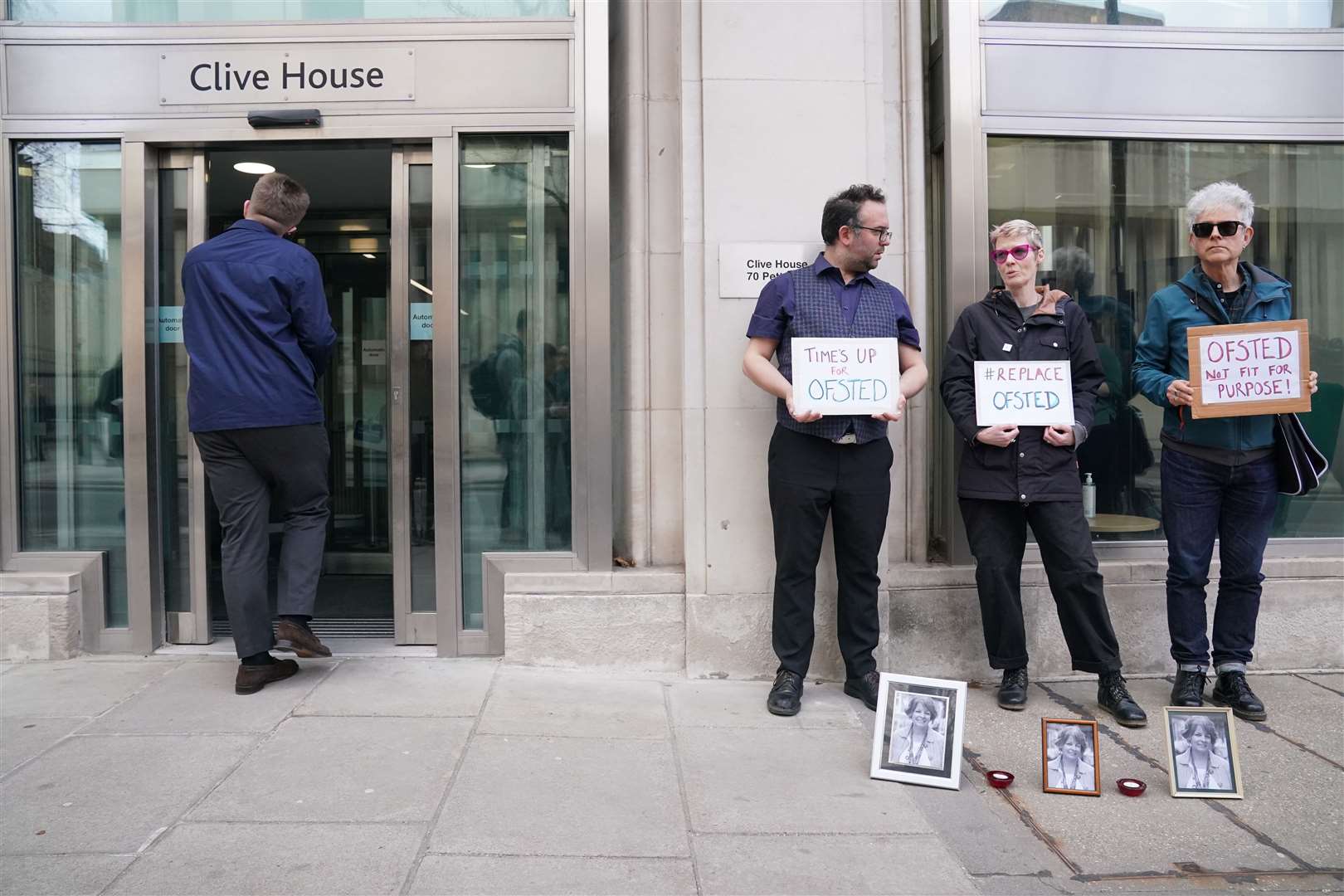 People attend a vigil for Ruth Perry outside the offices of Ofsted in Victoria, central London (Jonathan Brady/PA)