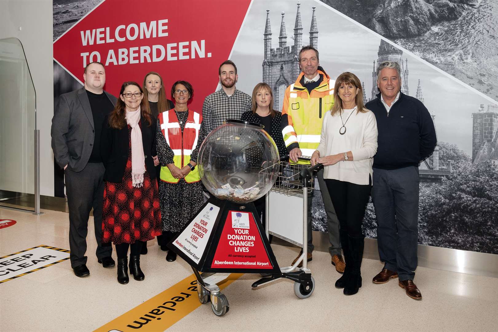 Representatives from Aberdeen International Airport's charity management group and AberNecessities.