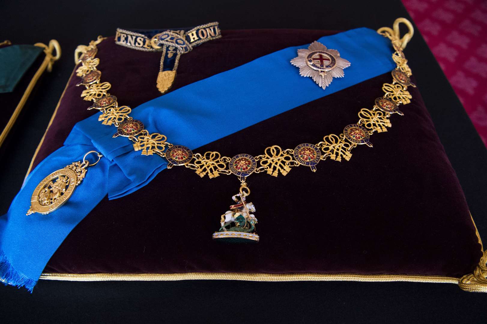 The Garter Collar and Greater George, and the Garter Breast Star and Lesser George sewn onto a cushion (Kirsty O’Connor/PA)