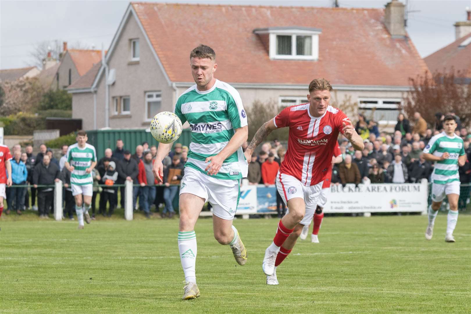 Buckie's Josh Peters pushing forward with the ball against Brechin's Hamish Thomson. ..Buckie Thistle F.C. v Brechin City F.C. Highland League Final at Victoria Park. ..Picture: Beth Taylor.