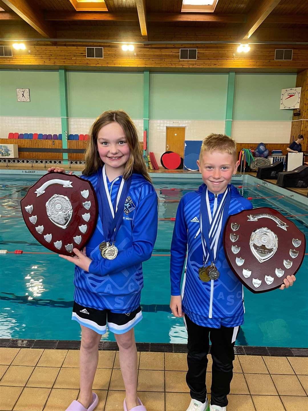 Emmie Murray and Riley Russell won the trophy for best local 10-year-old girl and boy at the Buckie meet.