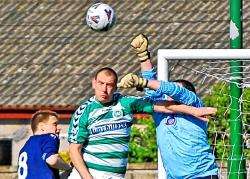 Danger in the Turriff box – Dave McKenzie (left), keeper Steven Coutts and Robbie Allan (right) try to subdue the aerial threat of Buckie’s Mike Morrison on Saturday. DF