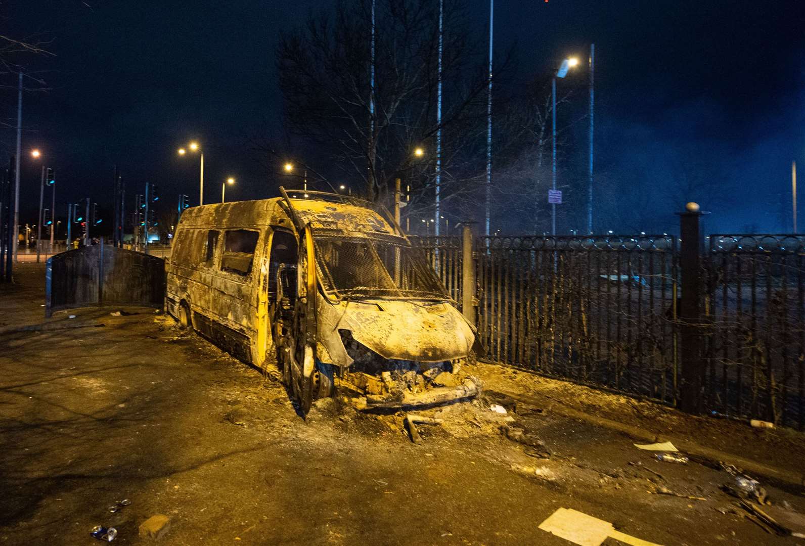 A burnt out police van after a demonstration outside the Suites Hotel in Knowsley, Merseyside, on Friday night (Peter Powell/PA) 