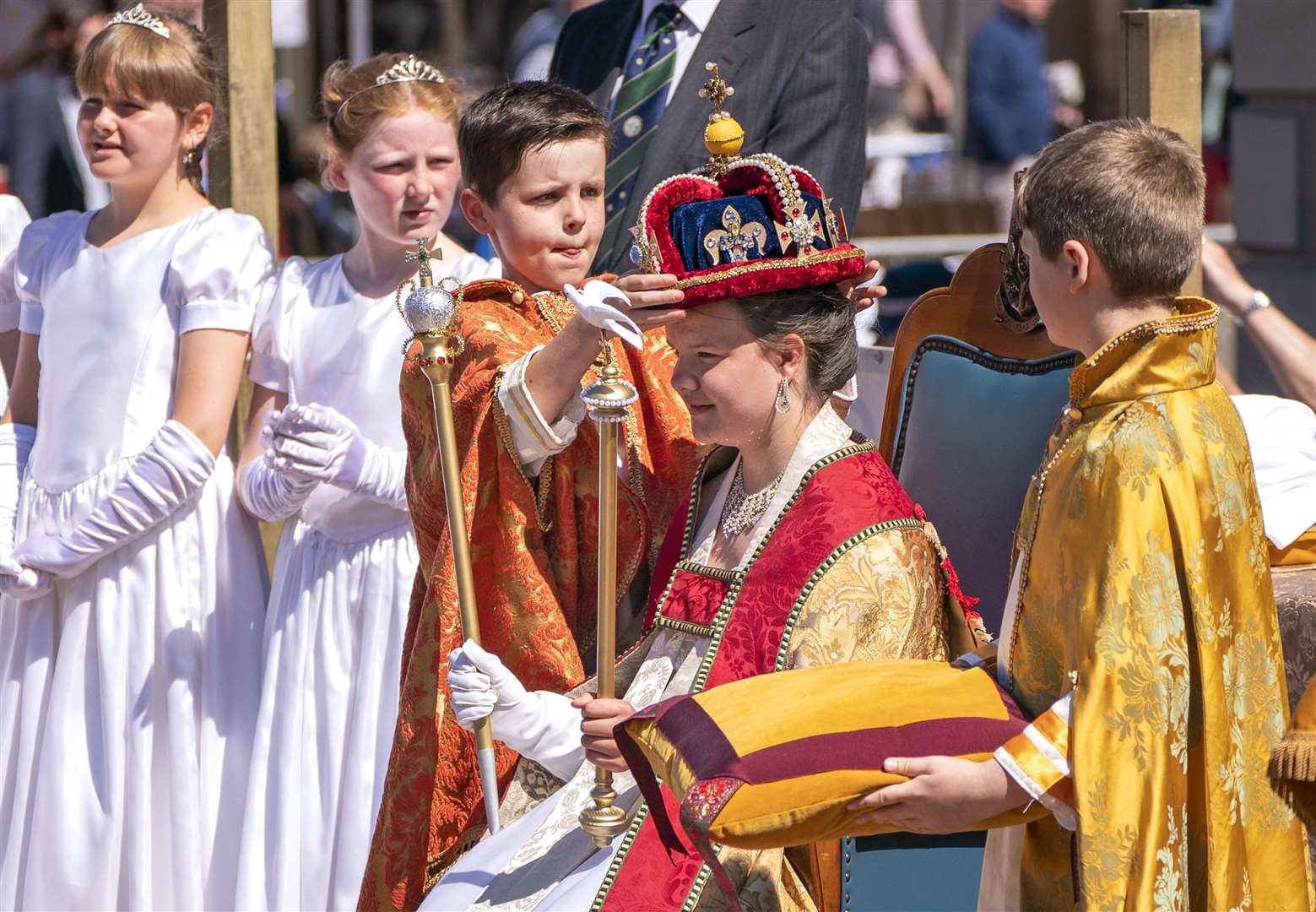 In the Scottish borders, a re-enactment of the Queen’s Coronation Day was acted out by local Cubs, Scouts and Guides in Kelso with Ben Redpath playing the part of the Archbishop of Canterbury and Susannah Ayling as the Queen (Jane Barlow/PA)