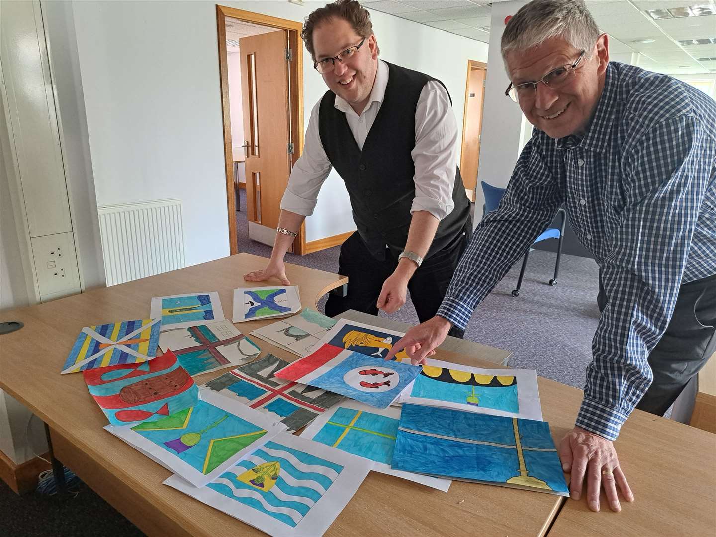 Lord lieutenant of Banffshire Andrew Simpson (right) and vexillologist Philip Tibbetts during the Banffshire flag voting at The Northern Scot office.