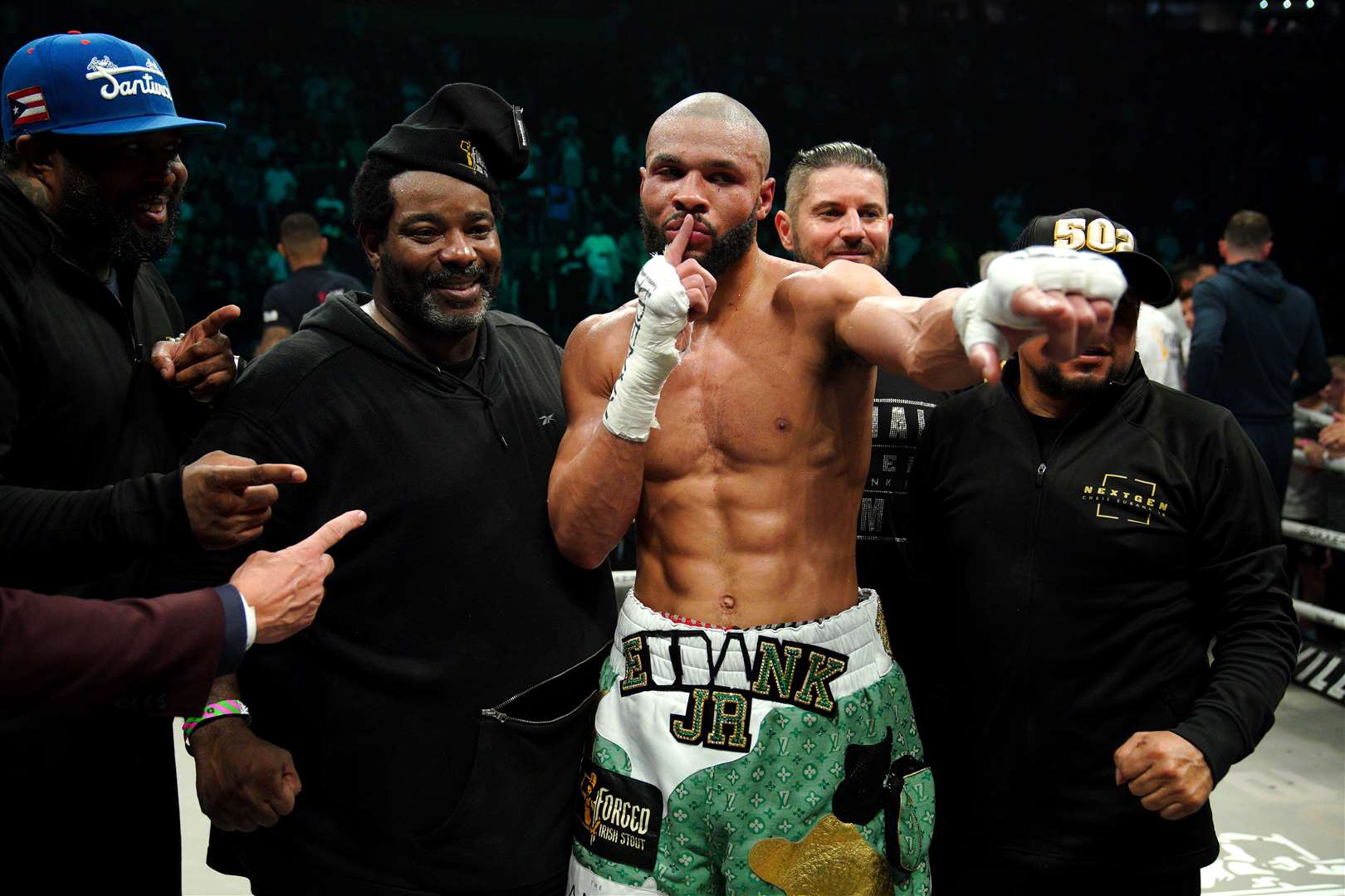 Chris Eubank Jr (centre) with trainer Brian McIntyre (second left) after his victory against Liam Smith via technical knockout on Saturday (Peter Byrne/PA)