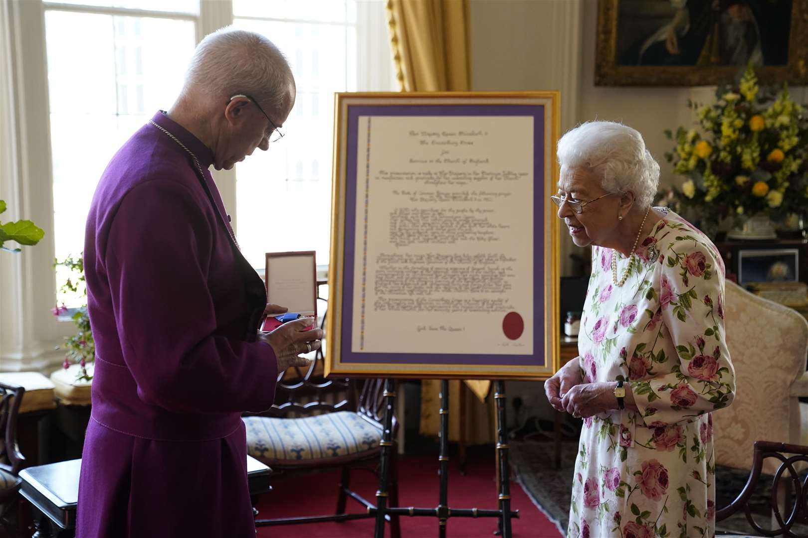 The Queen receives the Archbishop of Canterbury to receive a special ‘Canterbury Cross’ for her ‘unstinting’ service to the Church of England (Andrew Matthews/PA)