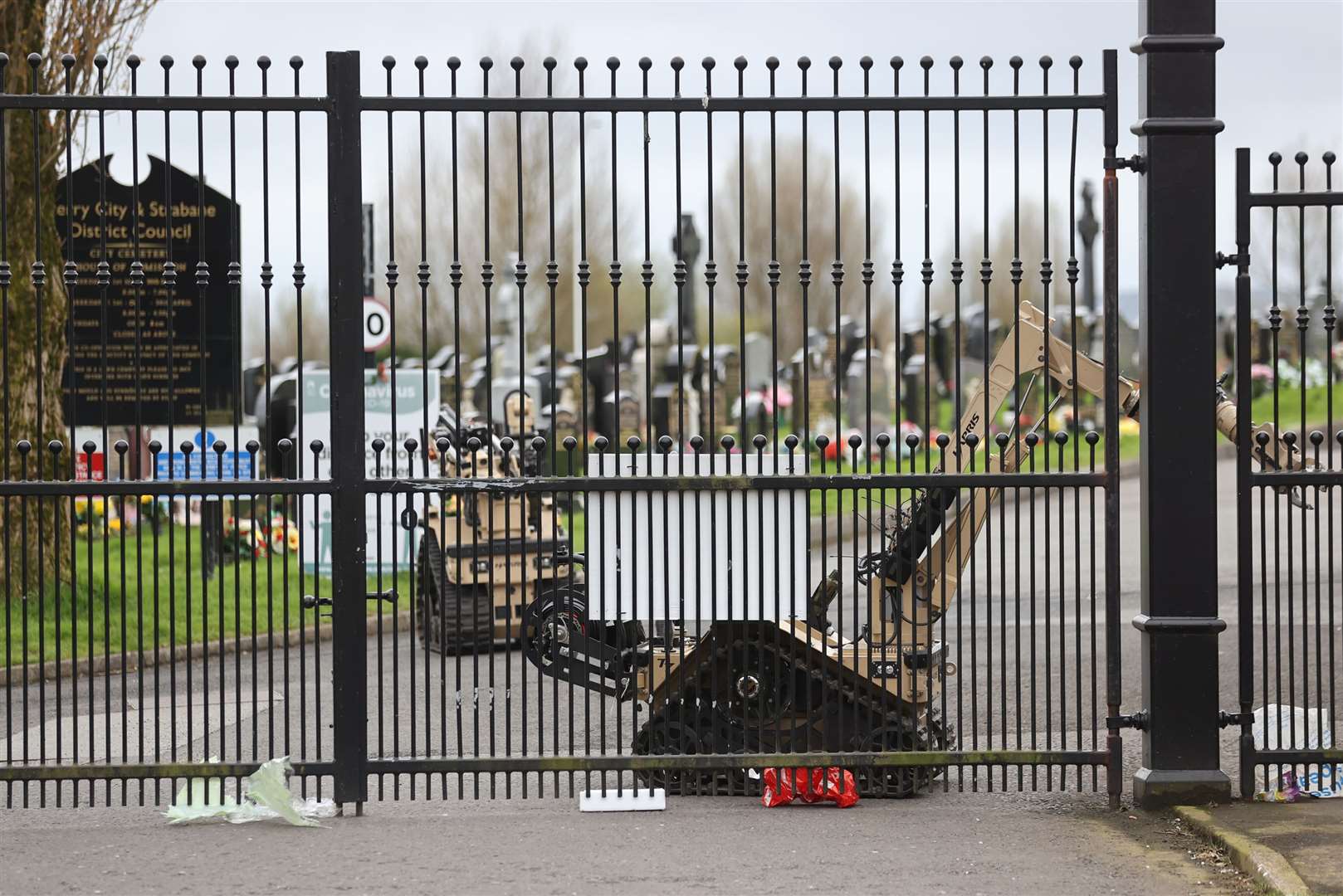 Robots examine the scene at Derry City Cemetery (Liam McBurney/PA).