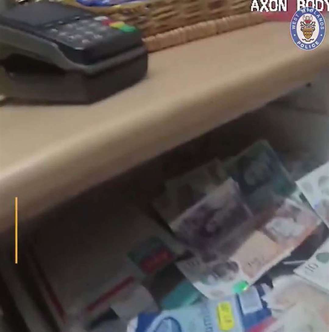 A still from body-worn police footage shows a card machine and a drawer filled with bank notes at the party (West Midlands Police/PA)