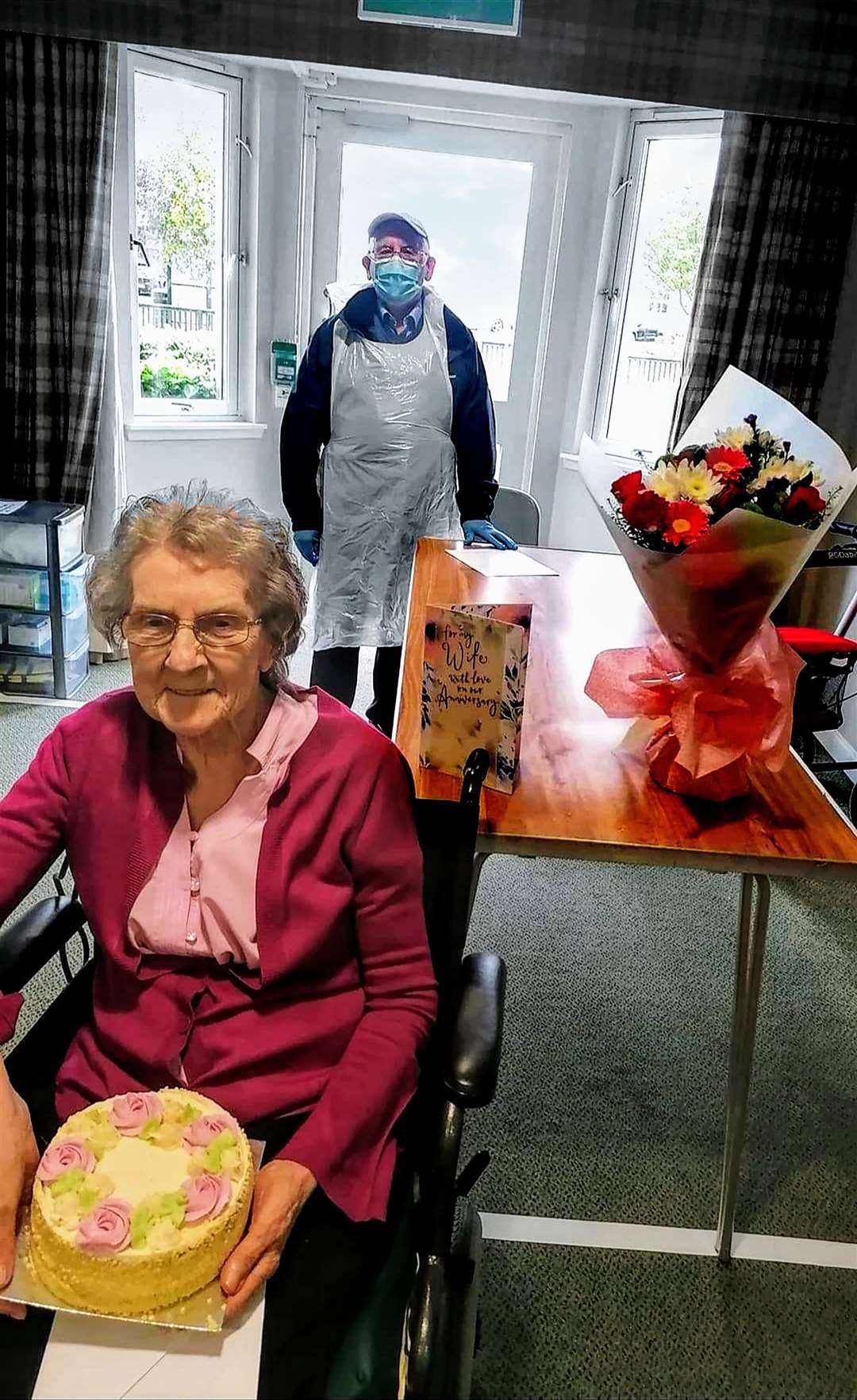 Alex and Margaret Cowie celebrate a socially distanced wedding anniversary at Parklands care home.