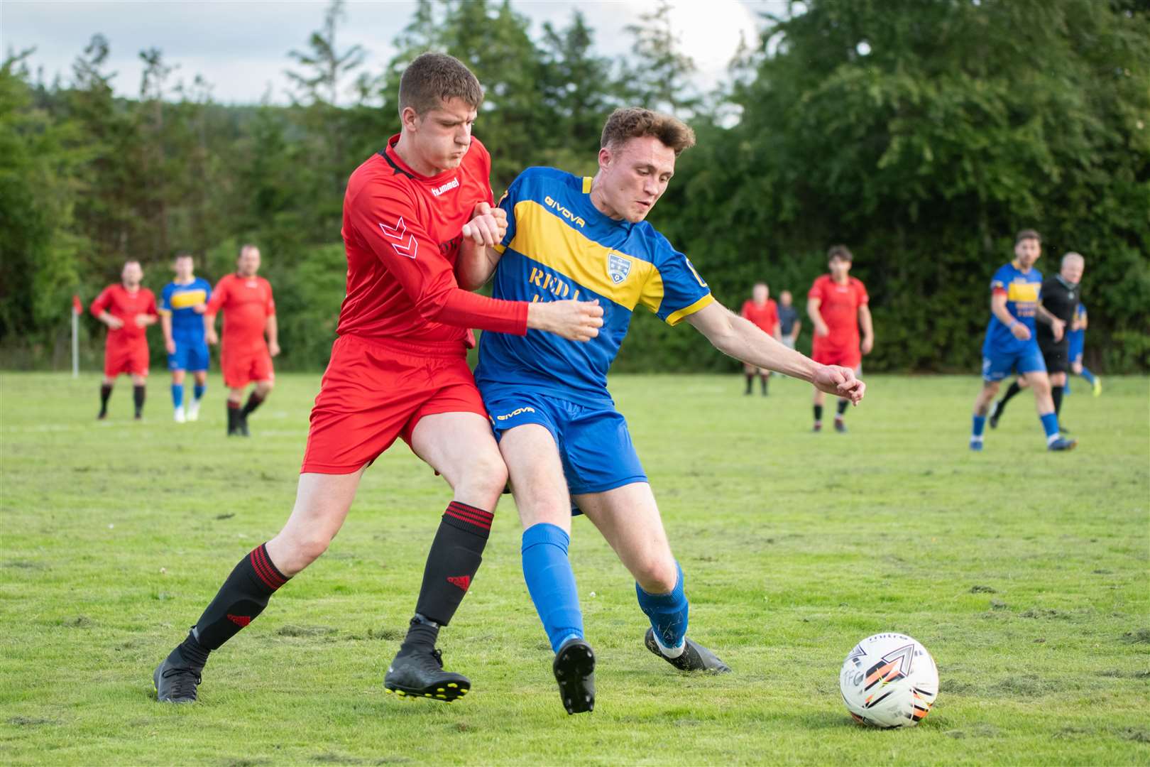 Lee Alexander (right) scored twice in FC Fochabers' crucial 3-2 success over Hopeman. Picture: Daniel Forsyth..