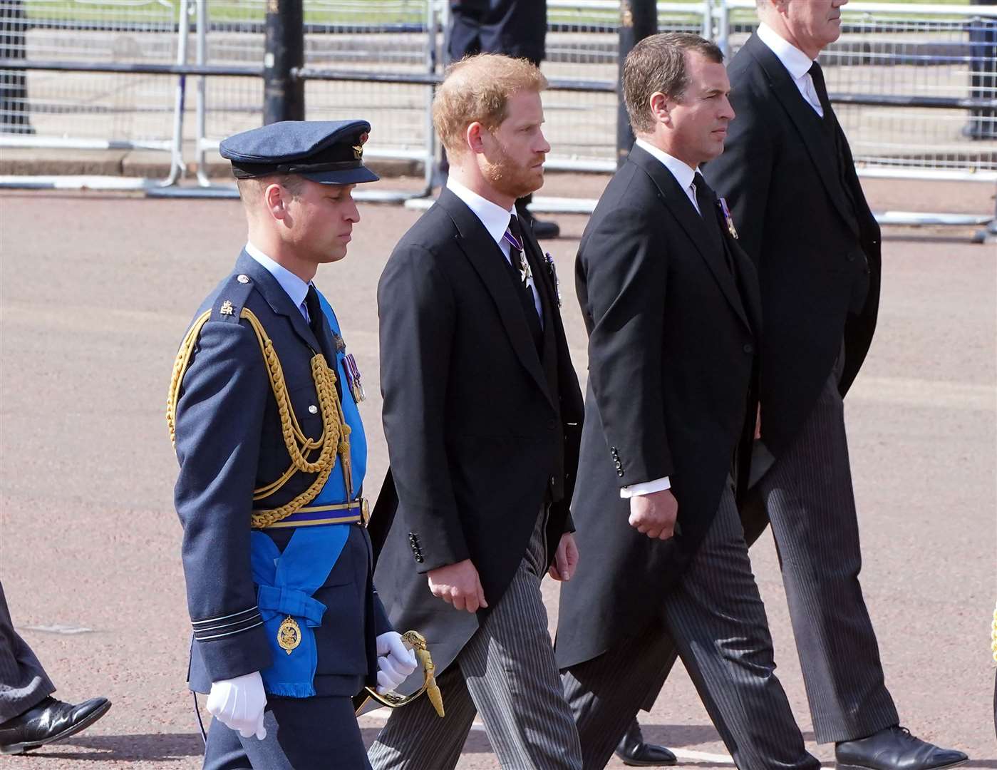 The Prince of Wales, the Duke of Sussex and Peter Phillips follow the coffin of the Queen (Ian West/PA)