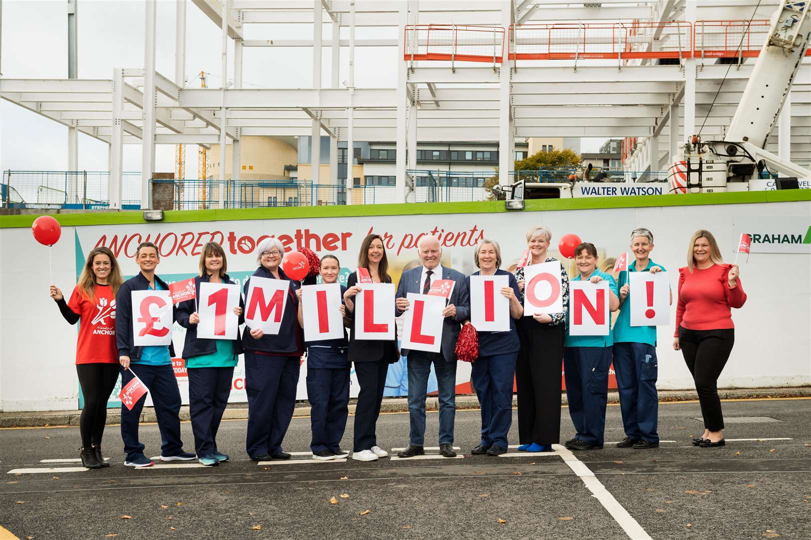 Friends of Anchor and NHS Grampian representatives celebrate the £1 million fundraising milestone.