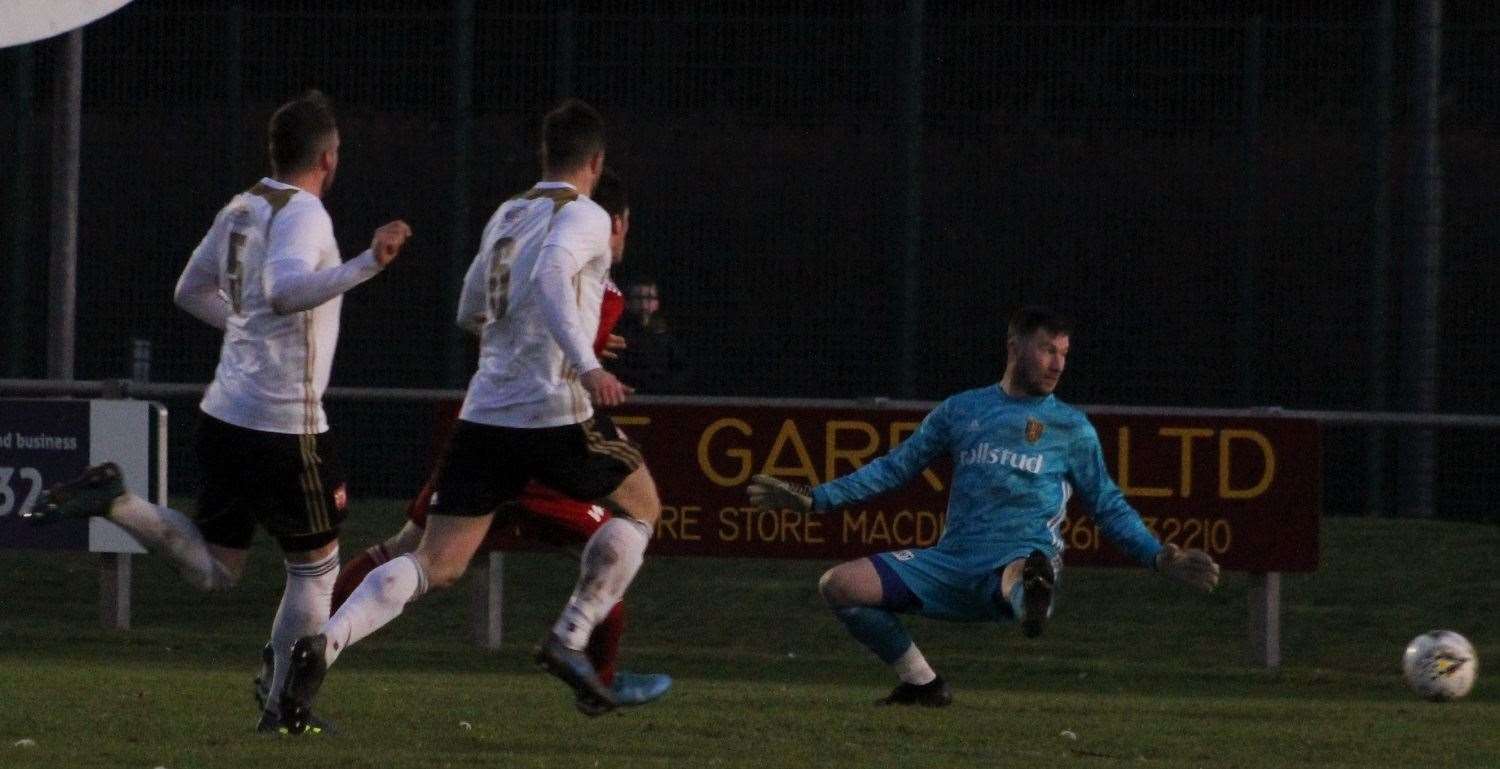 Colin Charlesworth weaves his way through a disjoined United defence to net the opener. Picture: Ian Rennie