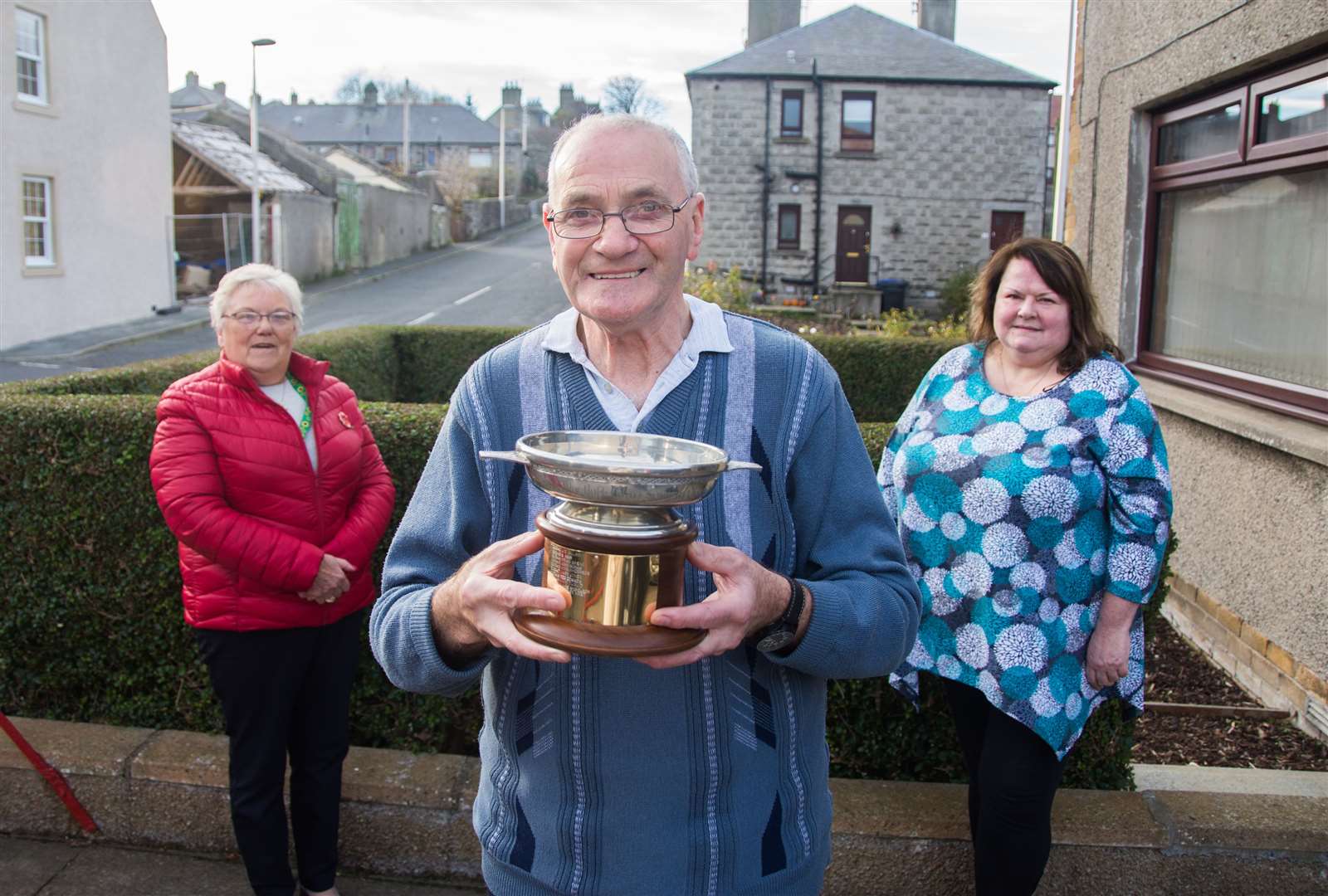 Banff and Macduff Community Council hand out their Outstanding Service to Community award to the Macduff Heritage Society. Alongside Stanley West from the society are Kathleen Mustard and Barbara Watt from the community council. Picture: Becky Saunderson.