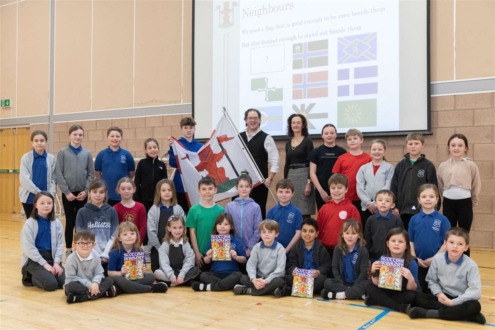 Vexillologist, Philip Tibbets (centre) and Deputy Lord-Lieutenant, Nancy Robson (centre, right) along with some pupils from Bishopmill Primary School which talks about the upcoming competition. ..Picture: Beth Taylor.